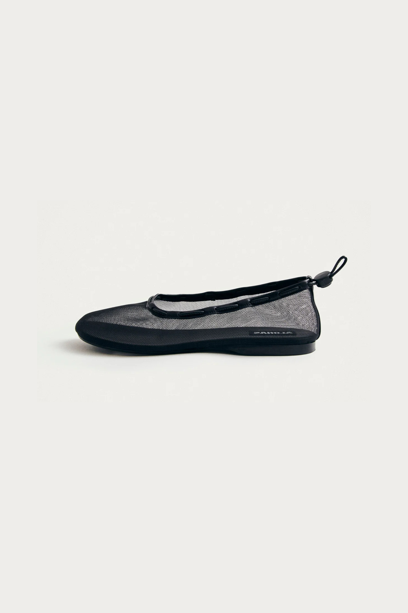 Alohas gill mesh leather ballet flats in black. Side view