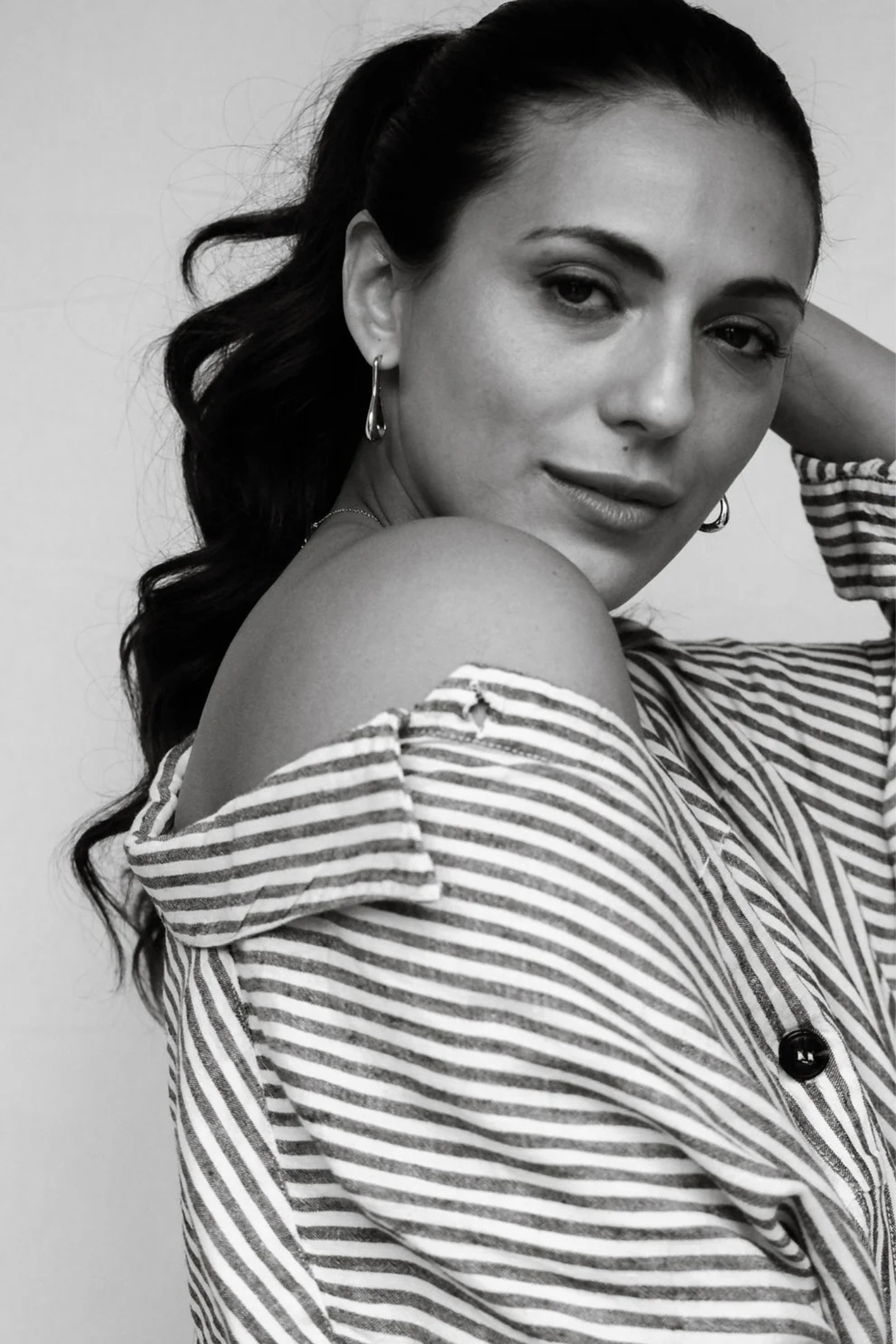 Model wearing the Maste colette earring in silver. Front view
