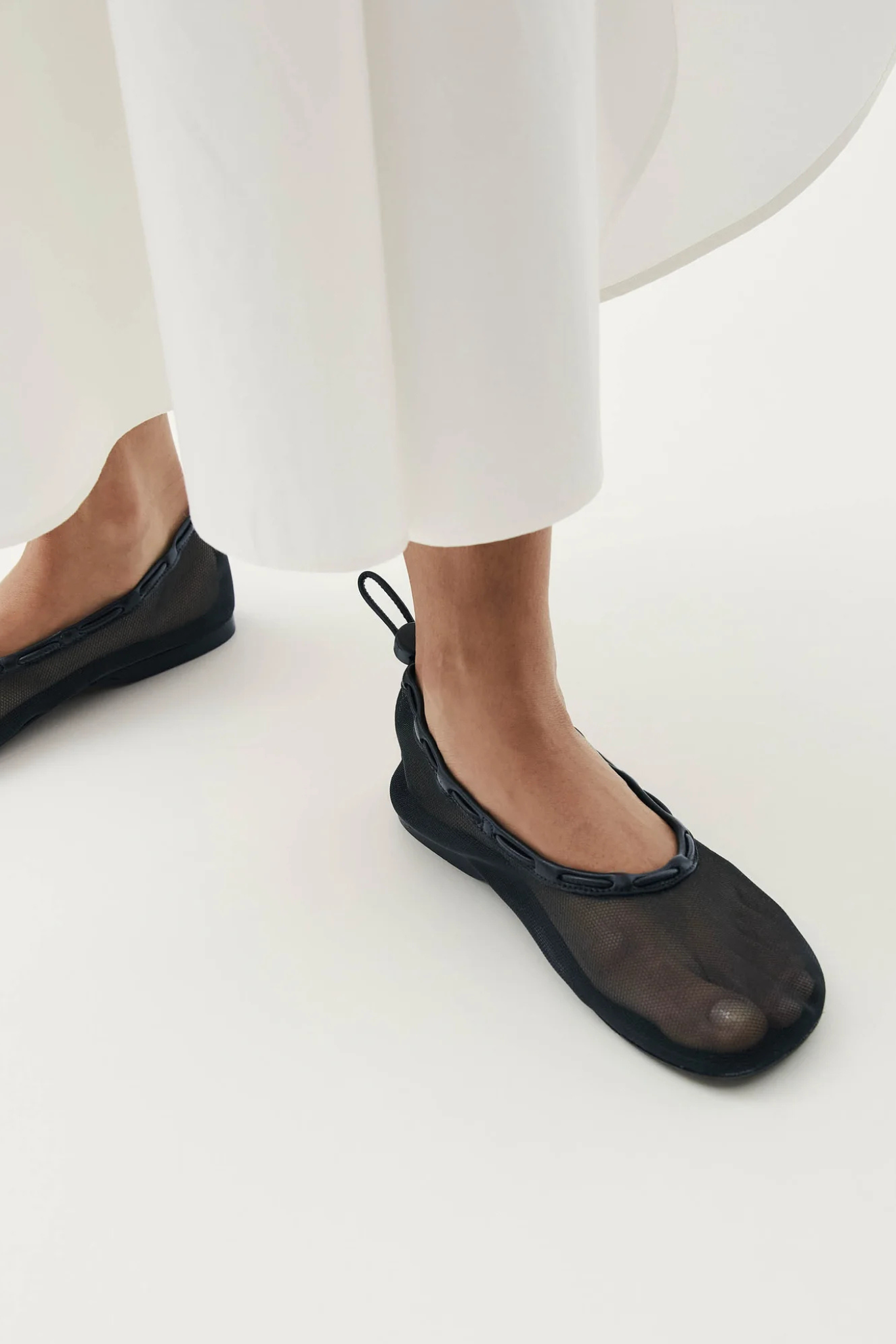 Alohas gill mesh leather ballet flats in black. Front view