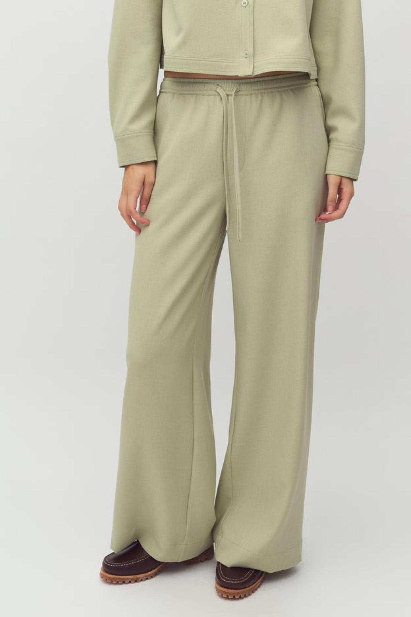 Model wearing the MBYM christoff morenna pants in pistachio/green. Front view