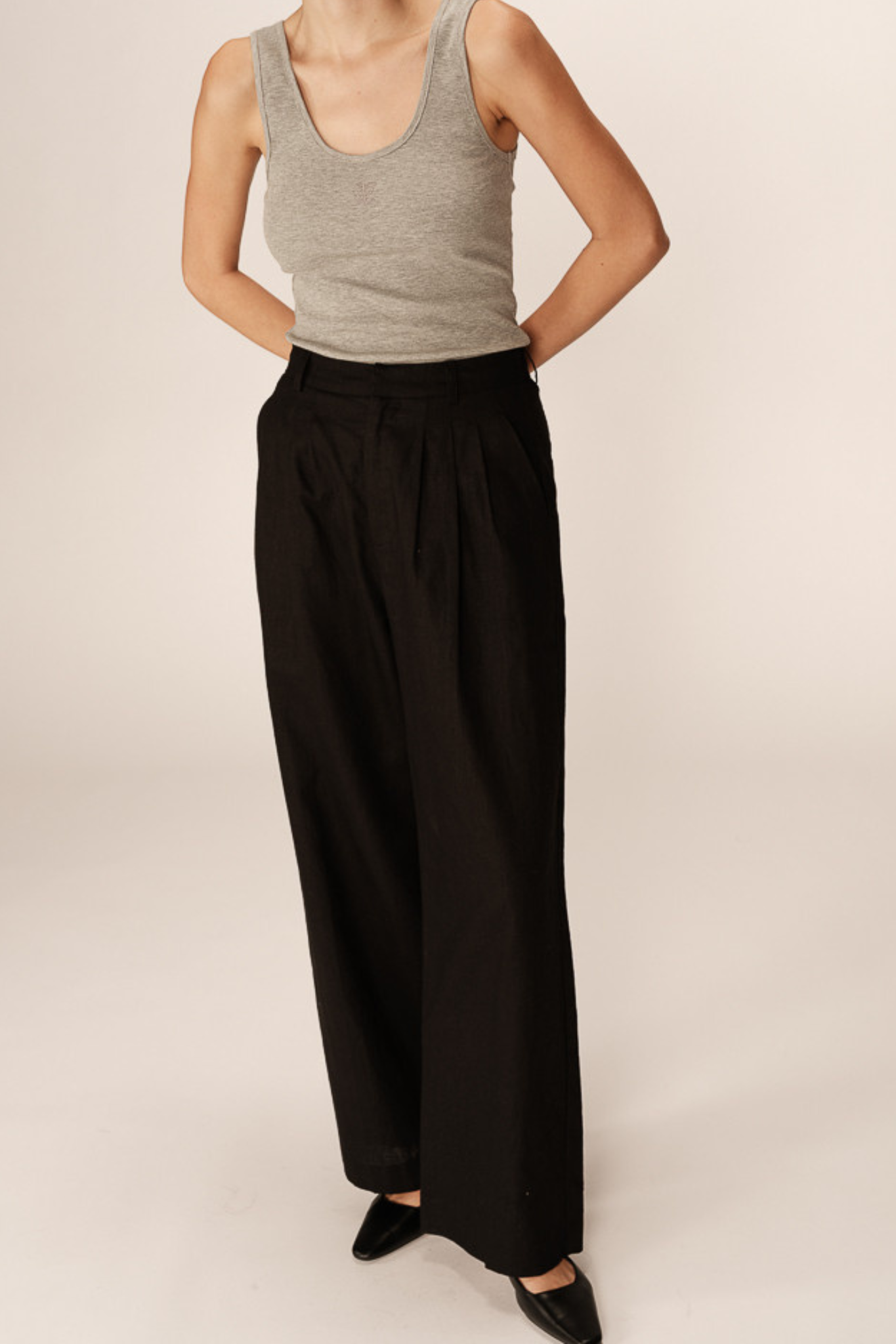 Model wearing the Grace & Mila phil pants in black. Front view