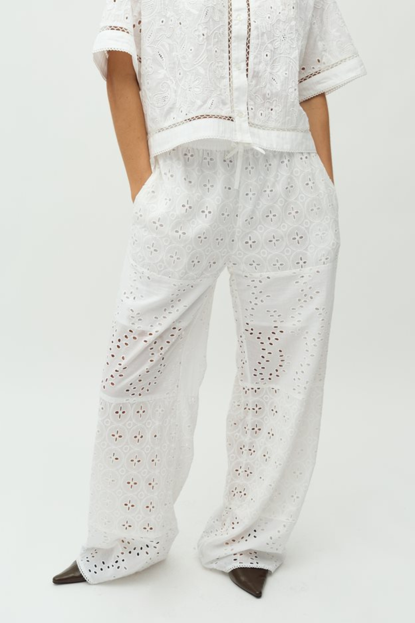 Model wearing the MBYM viljane embroidery pants in white. Front view