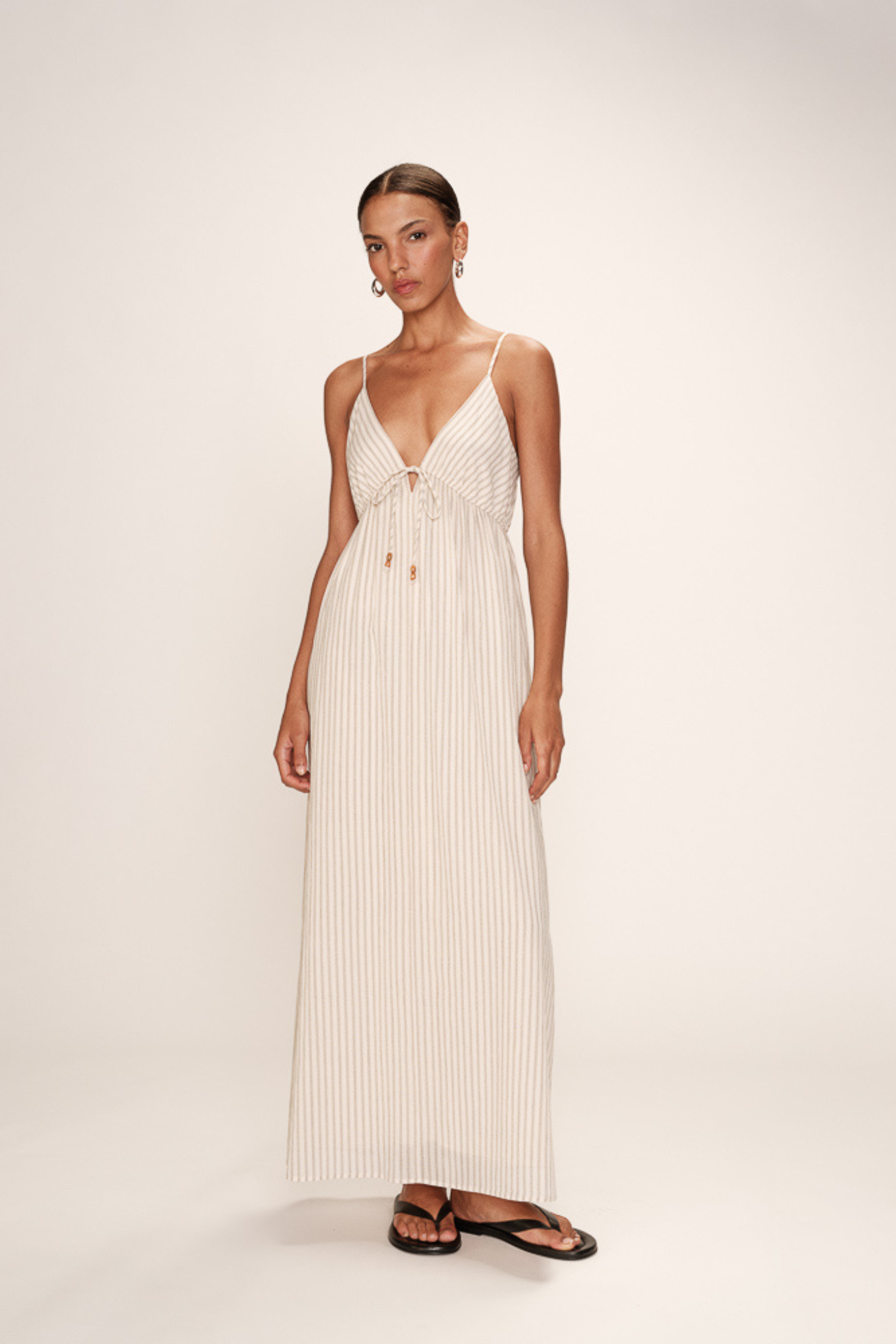 Model wearing the Grace & Mila raja dress in ecru. Front view