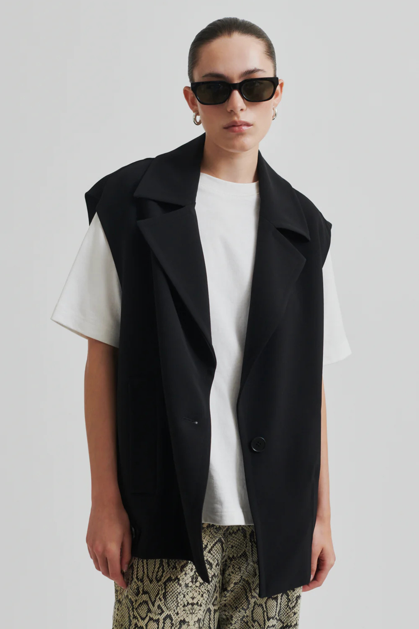 Model wearing the Second Female fique oversize waistcoat in black. Front view