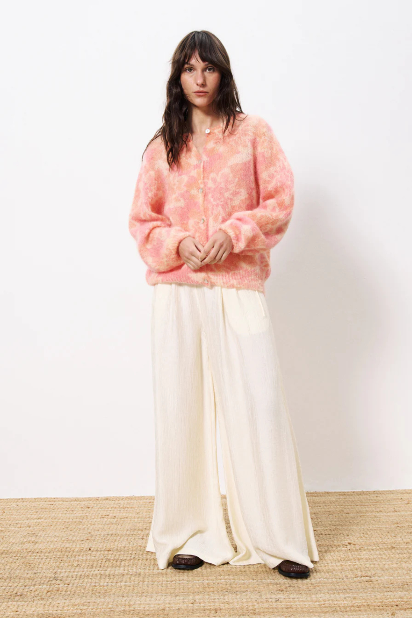 Model wearing the FRNCH calixta cardigan in multi/flowers. Front view
