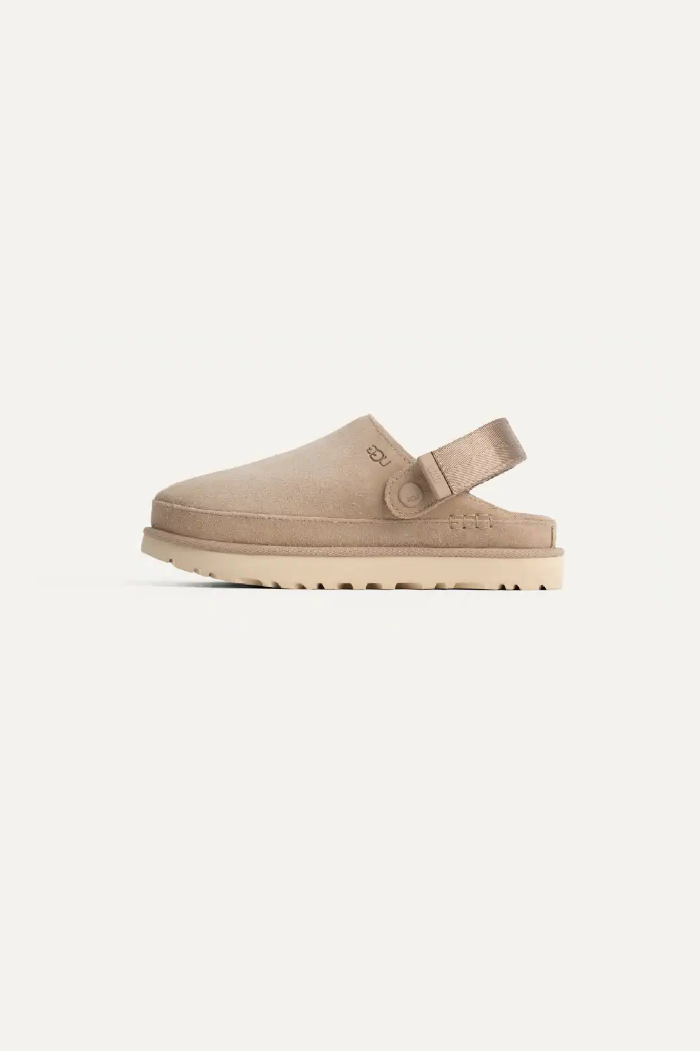 UGG women goldenstar clog in sand. Side view