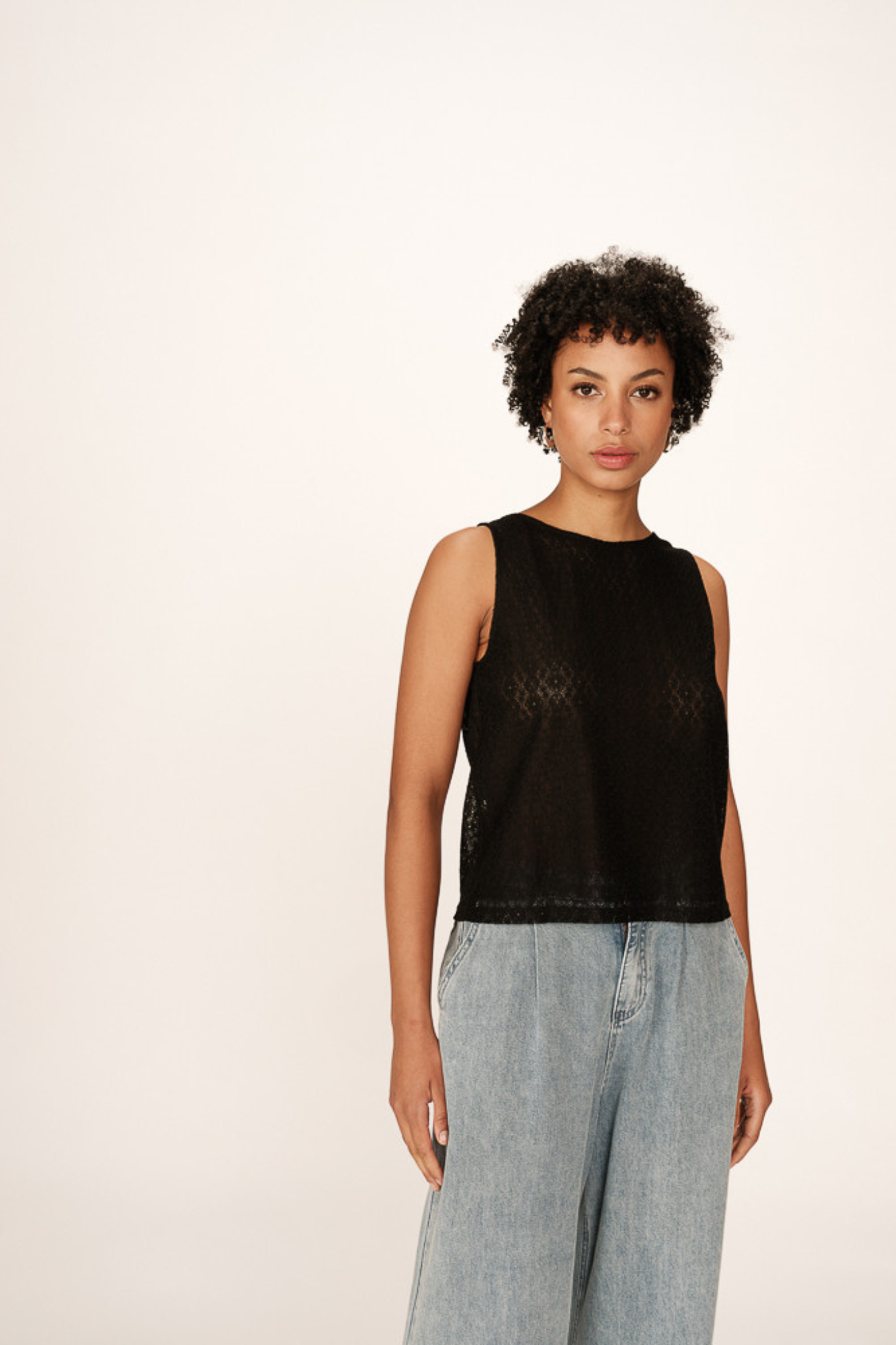 Model wearing the Grace & Mila passionnee top in black. Front view