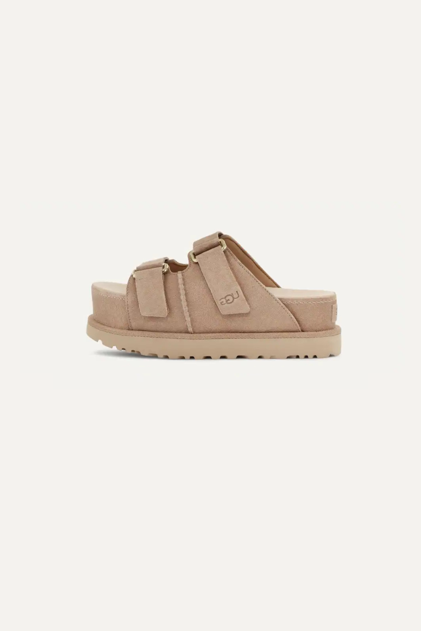 UGG women goldenstar hi slide in sand. Side view