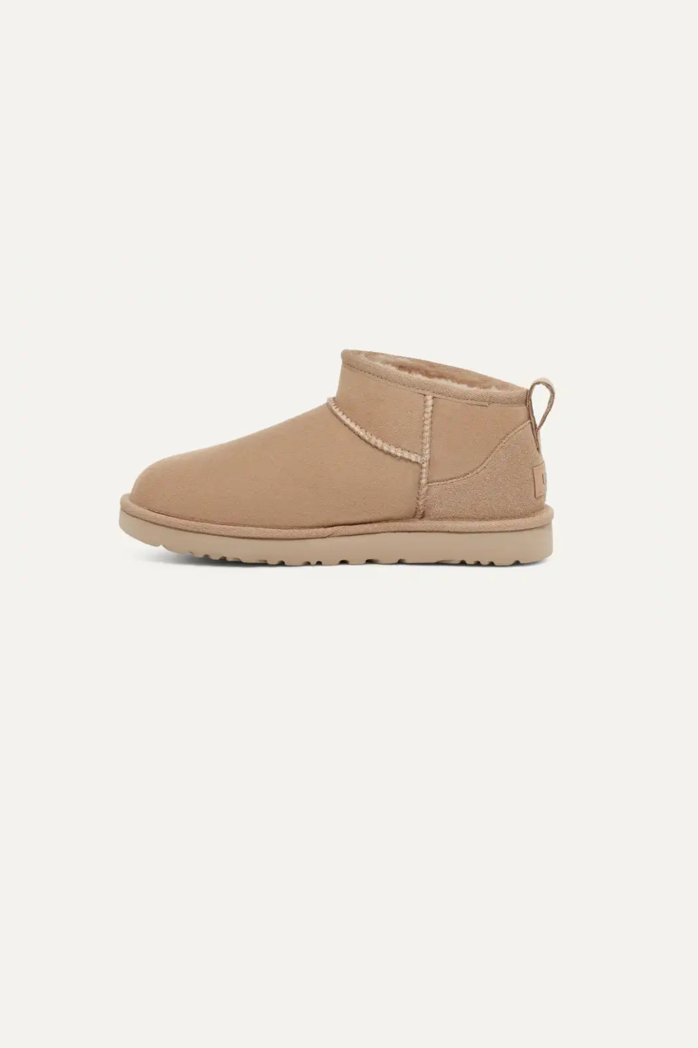 UGG women classic ultra mini in sand. Side view
