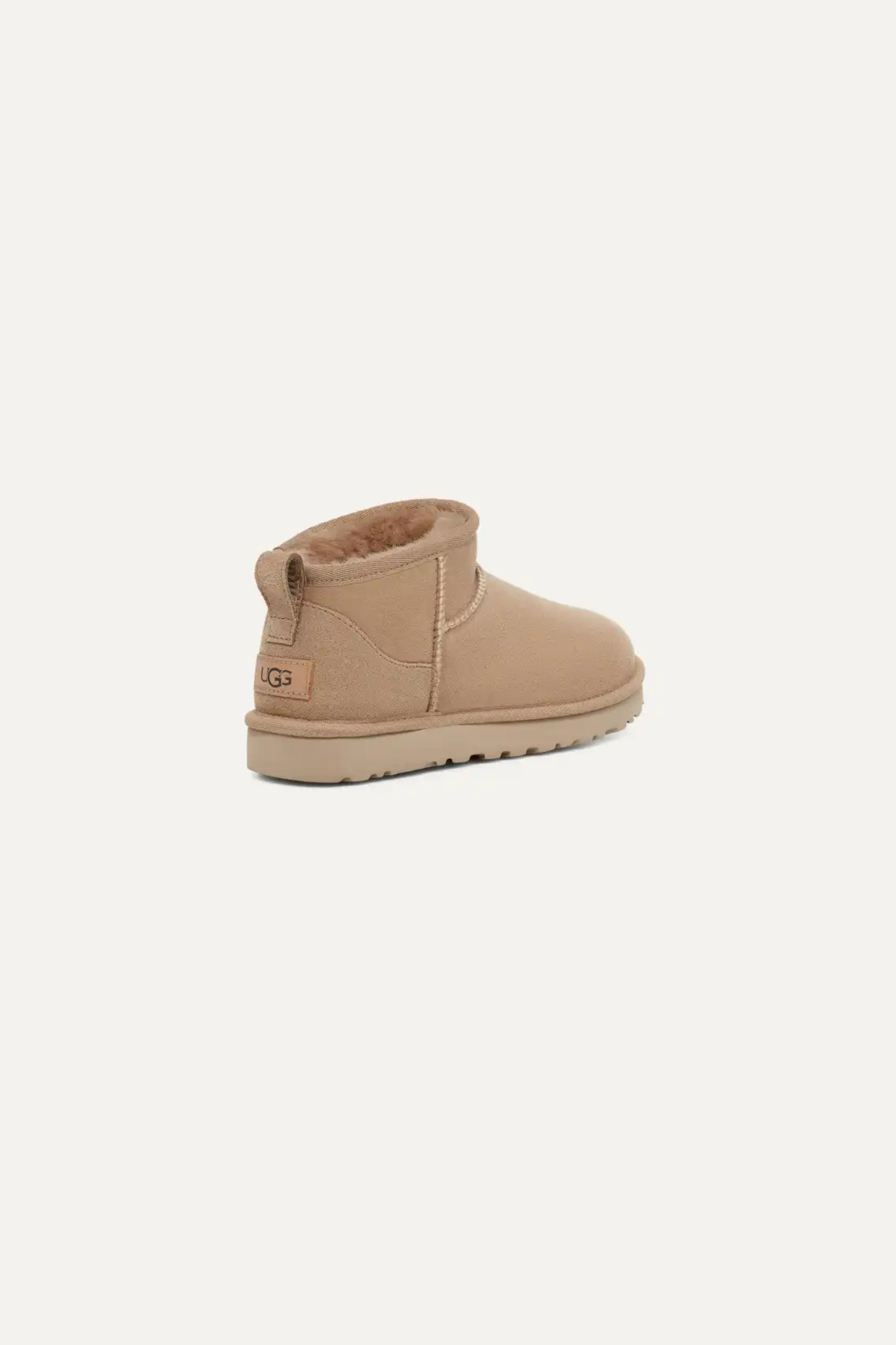 UGG women classic ultra mini in sand. Back view