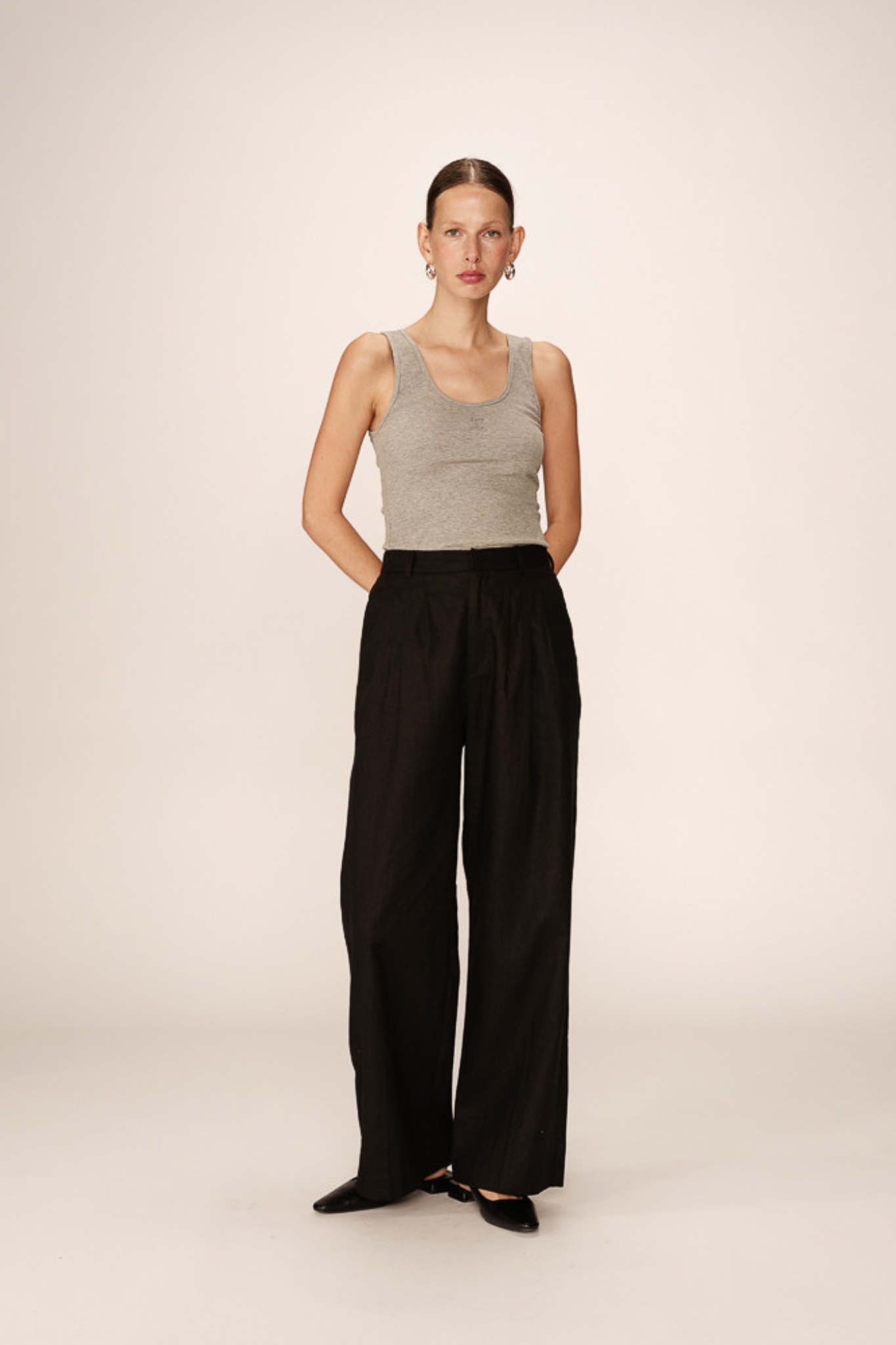 Model wearing the Grace & Mila phil pants in black. Front view