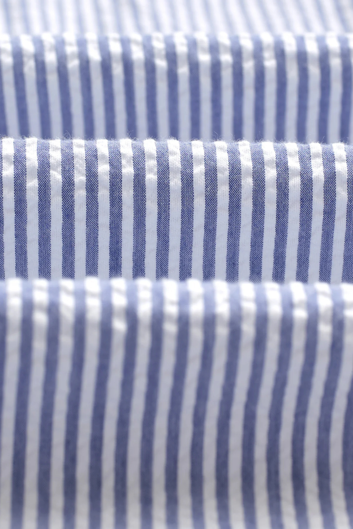 Wax London rove seersucker stripe shirt in blue. Close fabric view