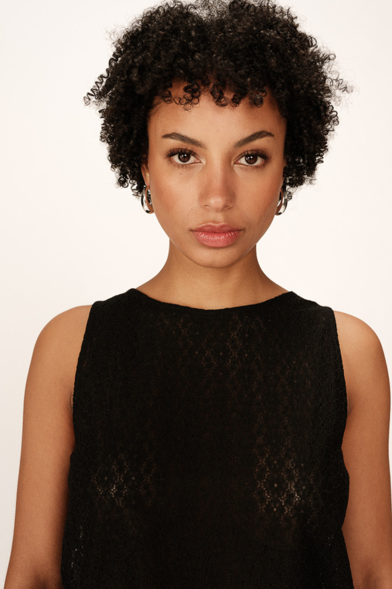 Model wearing the Grace & Mila passionnee top in black. Front view