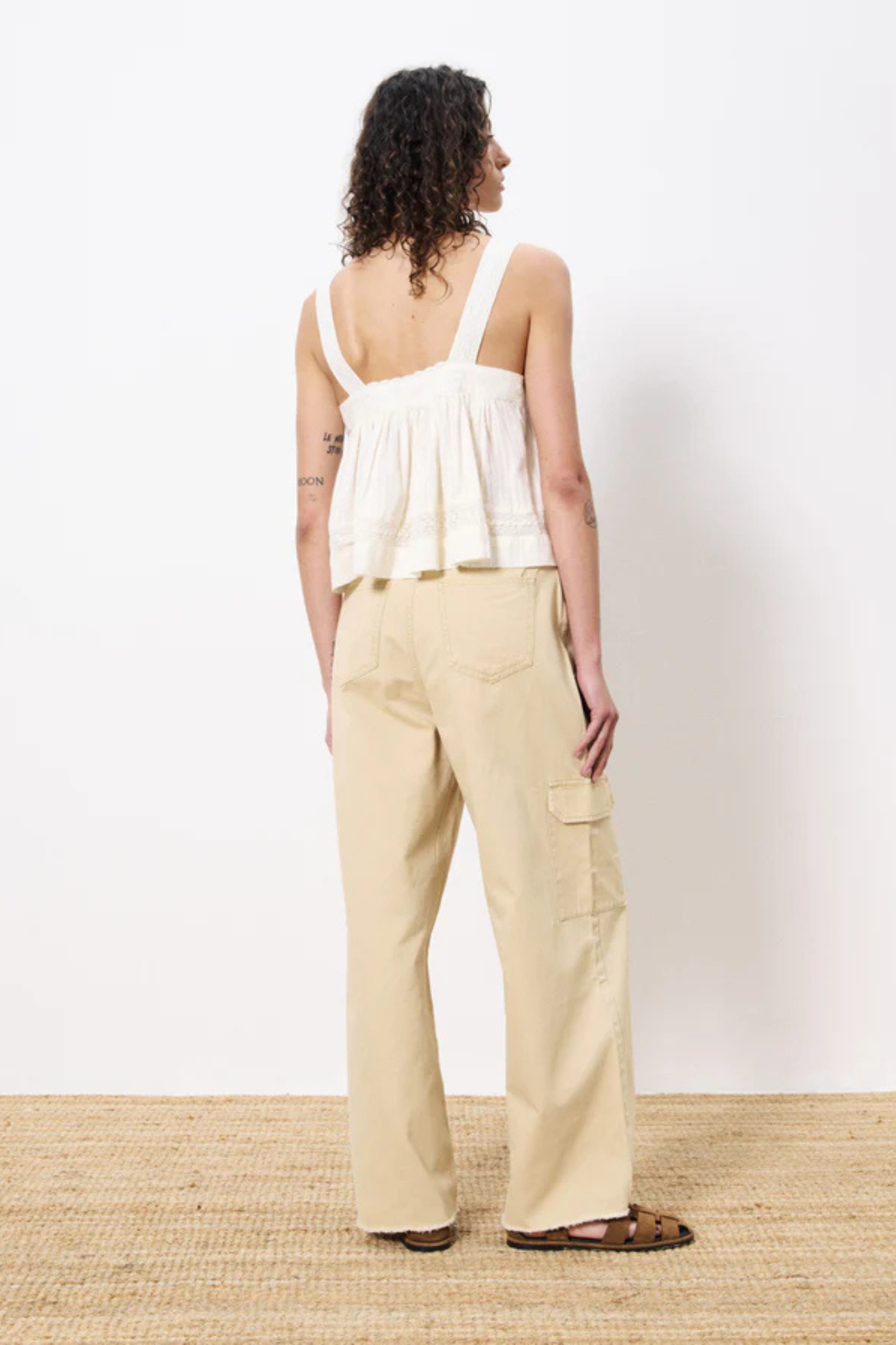 Model wearing the FRNCH lalita top in creme. Back view