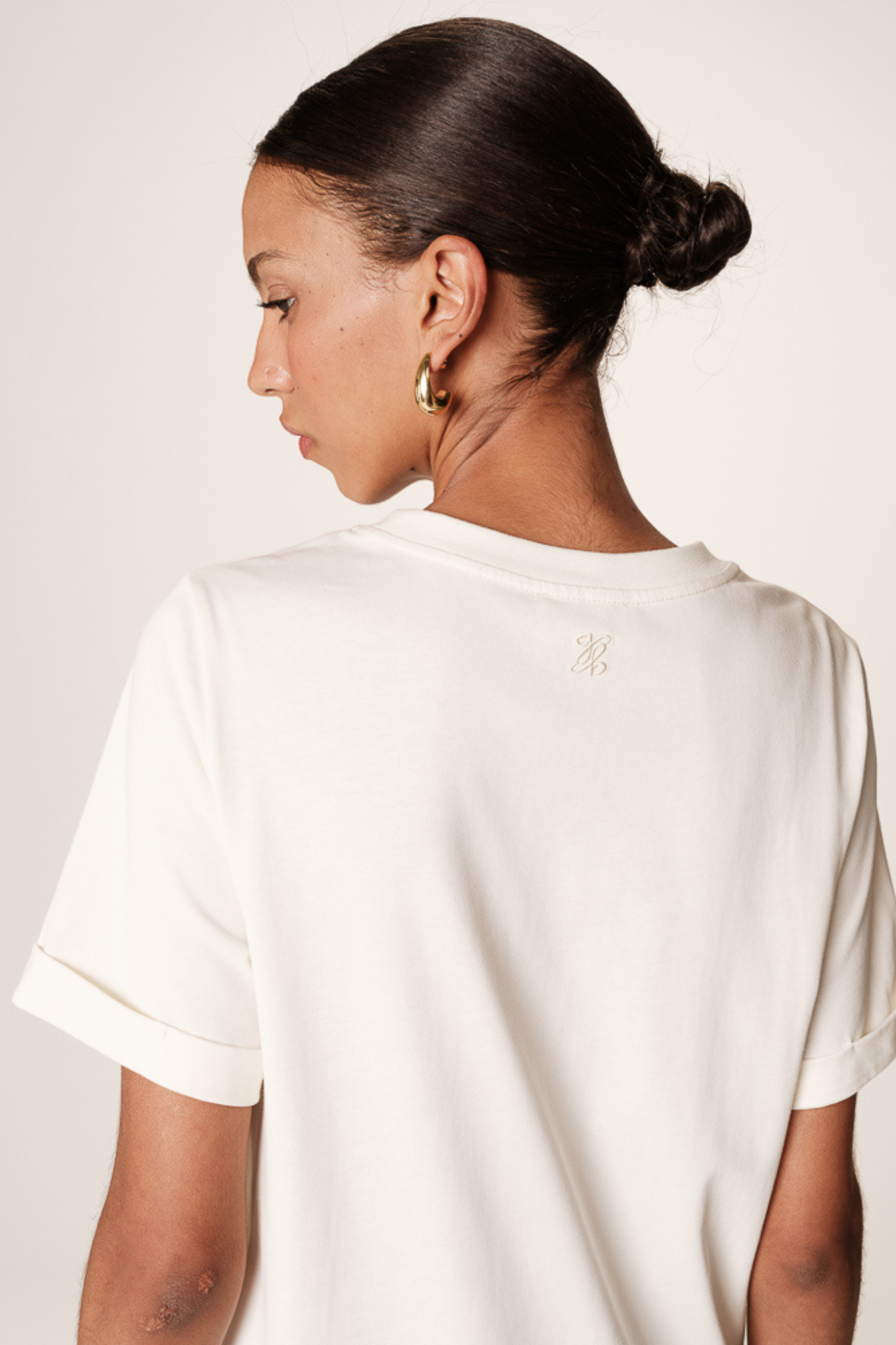 Model wearing the Grace & Mila rosalie dress in ecru. Close back view