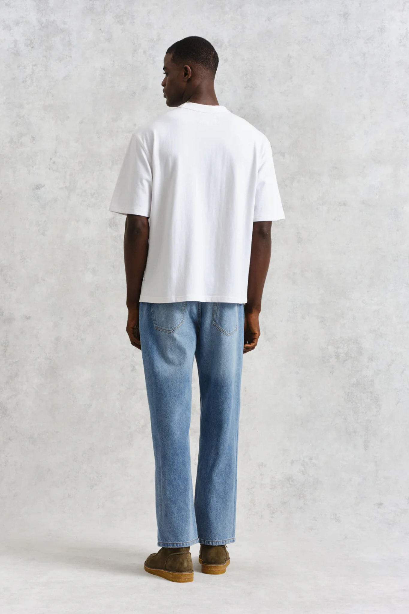 Model wearing the Wax London milton t-shirt in white. Back view