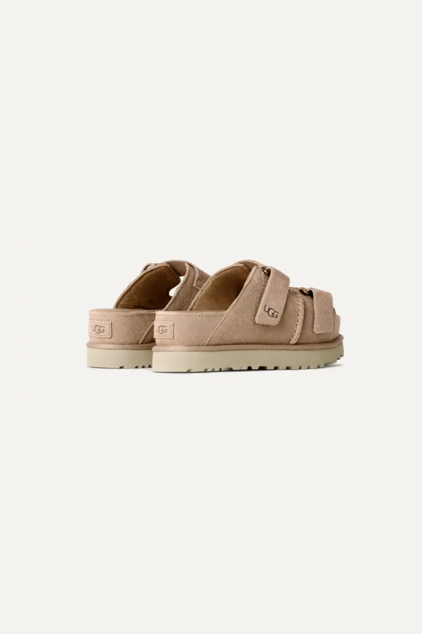 UGG women goldenstar hi slide in sand. Side view