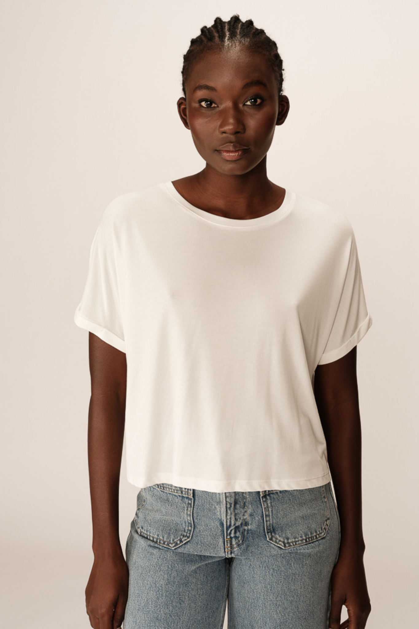 Model wearing the Grace & Mila parma t-shirt in ecru. Front view