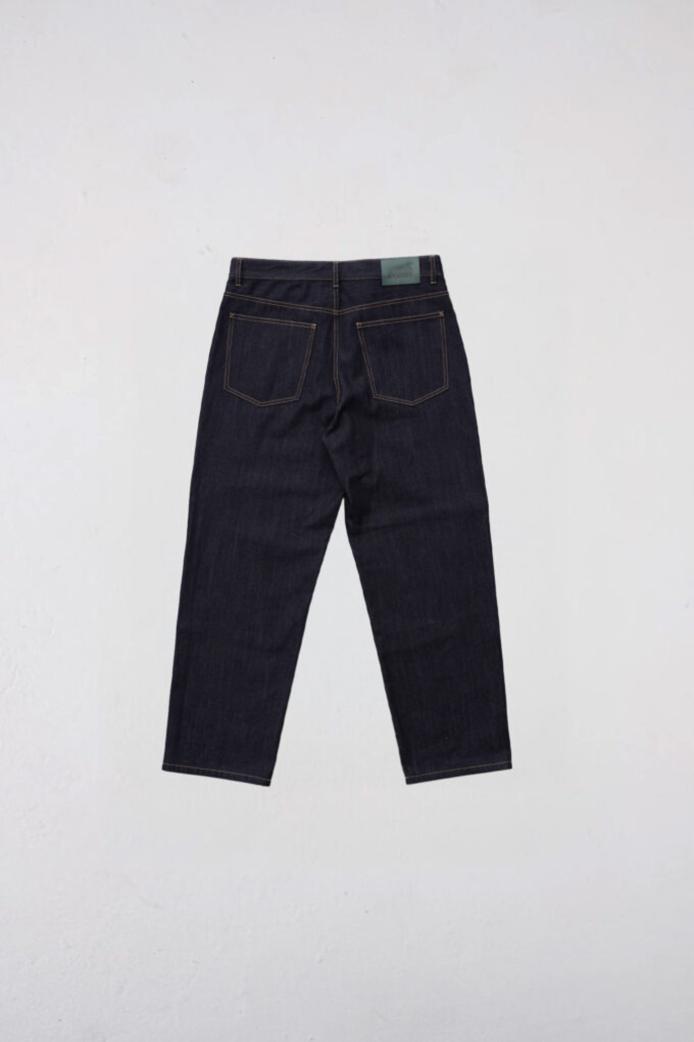 Goodies Sportive raw denim wide leg pants in dark denim. Back flatlay view