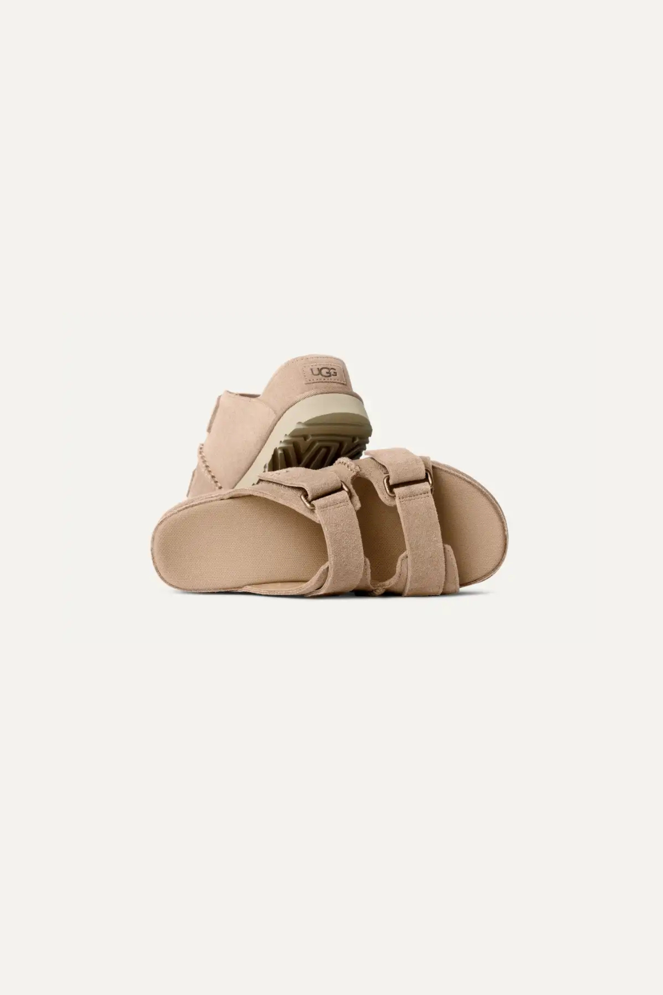 UGG women goldenstar hi slide in sand. Front view