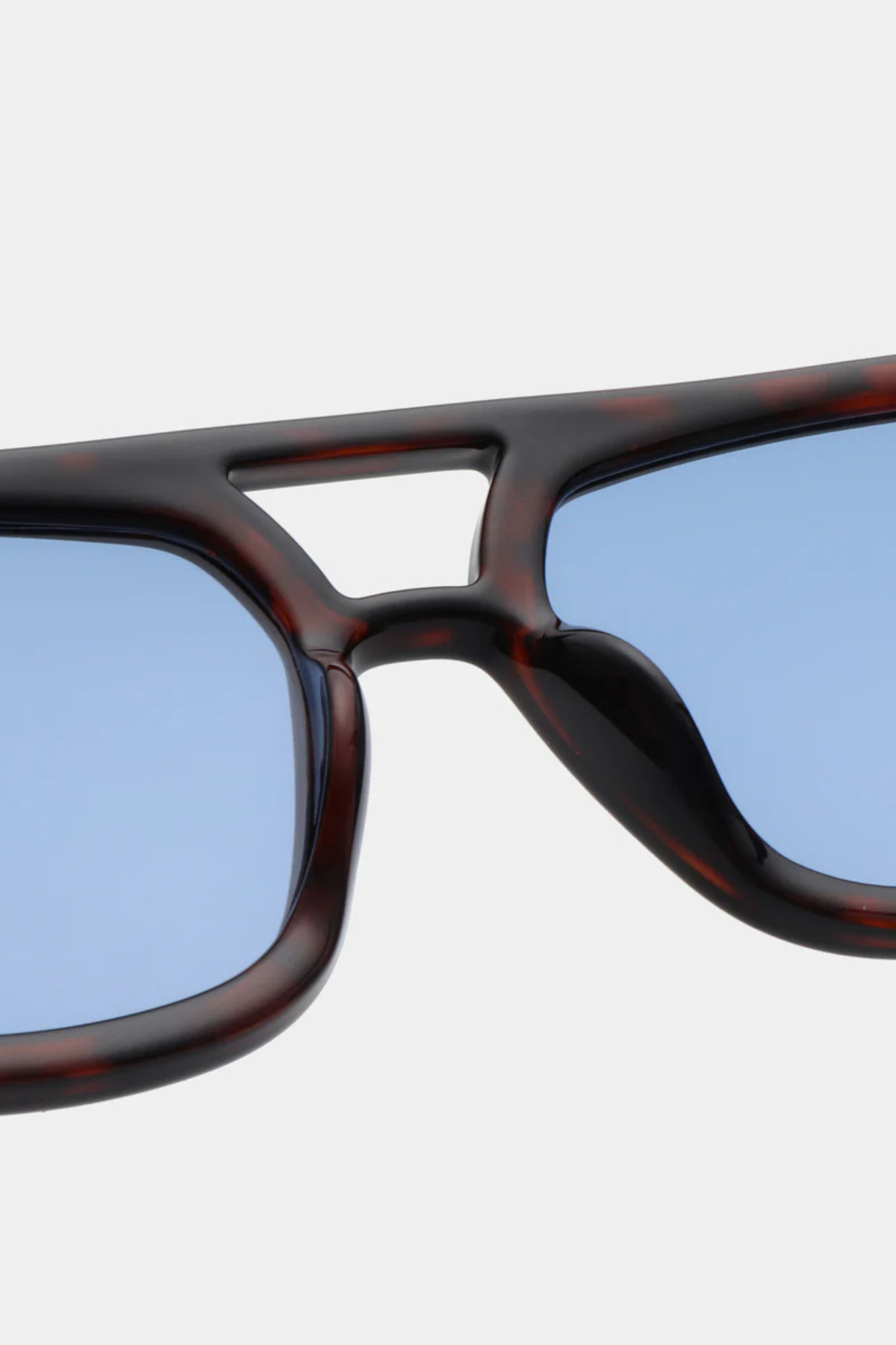 A. Kjaerbede kaya sunglasses in demi tortoise (blue lens). Close front view