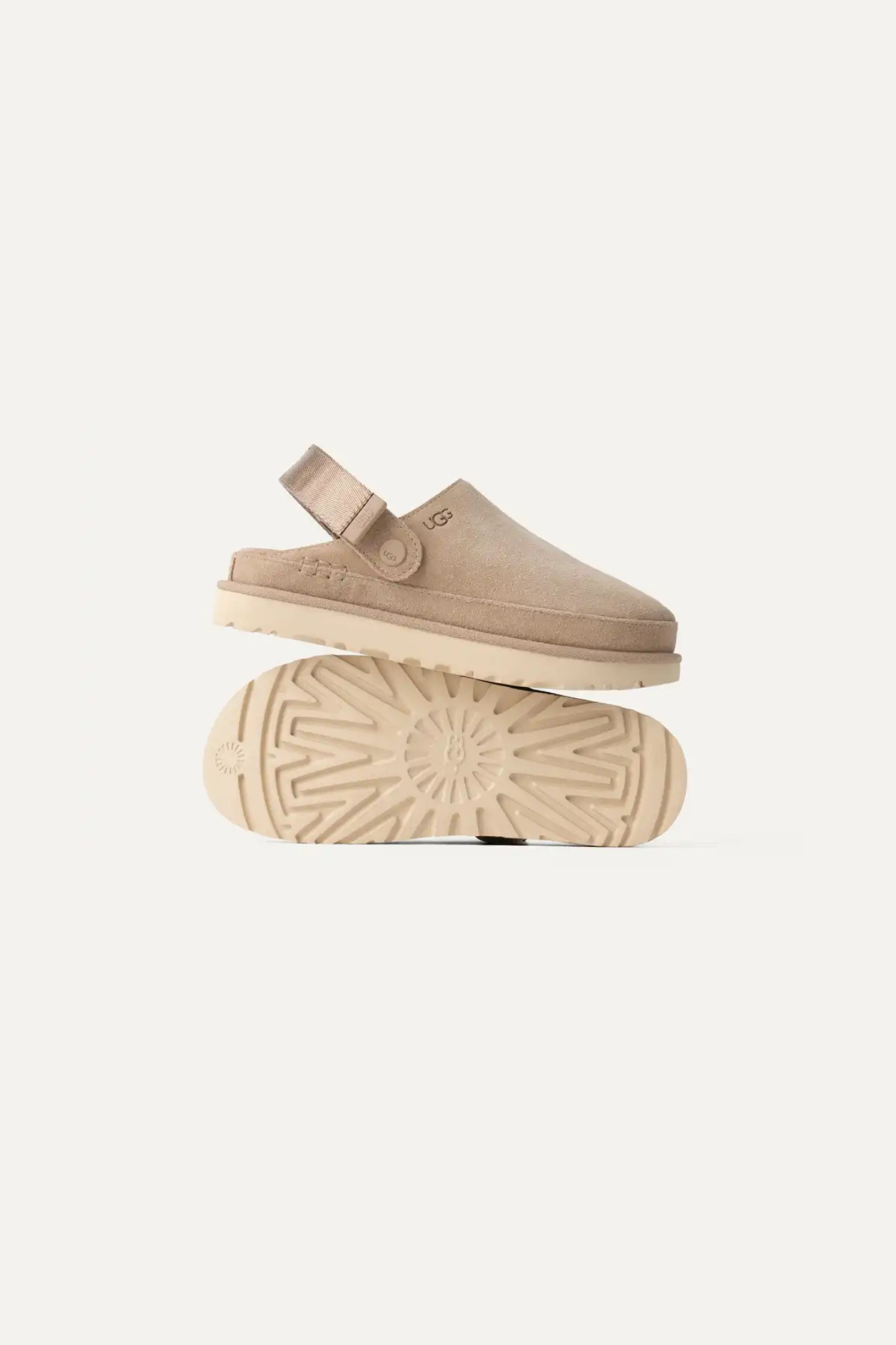 UGG women goldenstar clog in sand. Side view