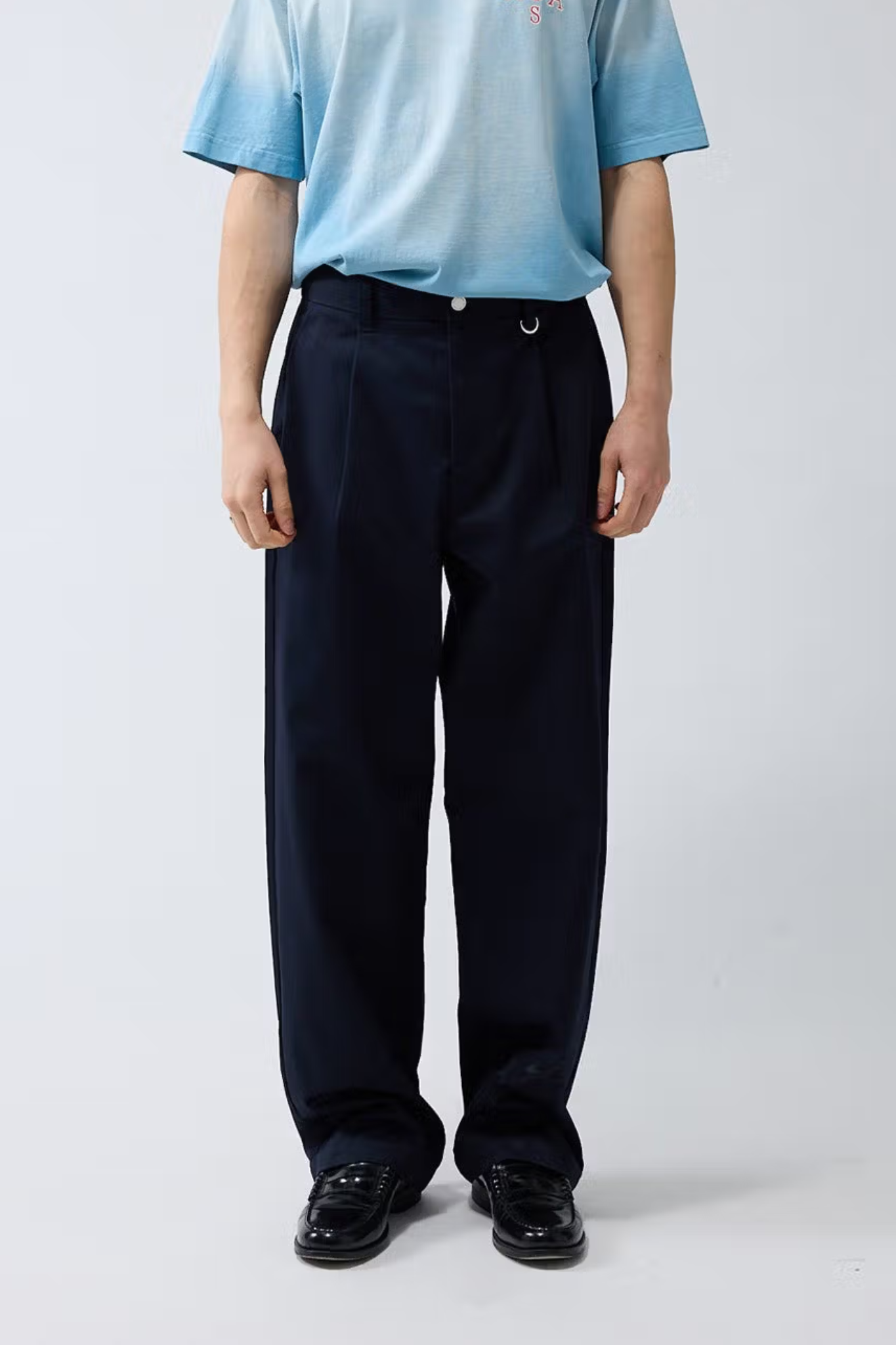 Model wearing the New Amsterdam reworked pants in night blue. Front view