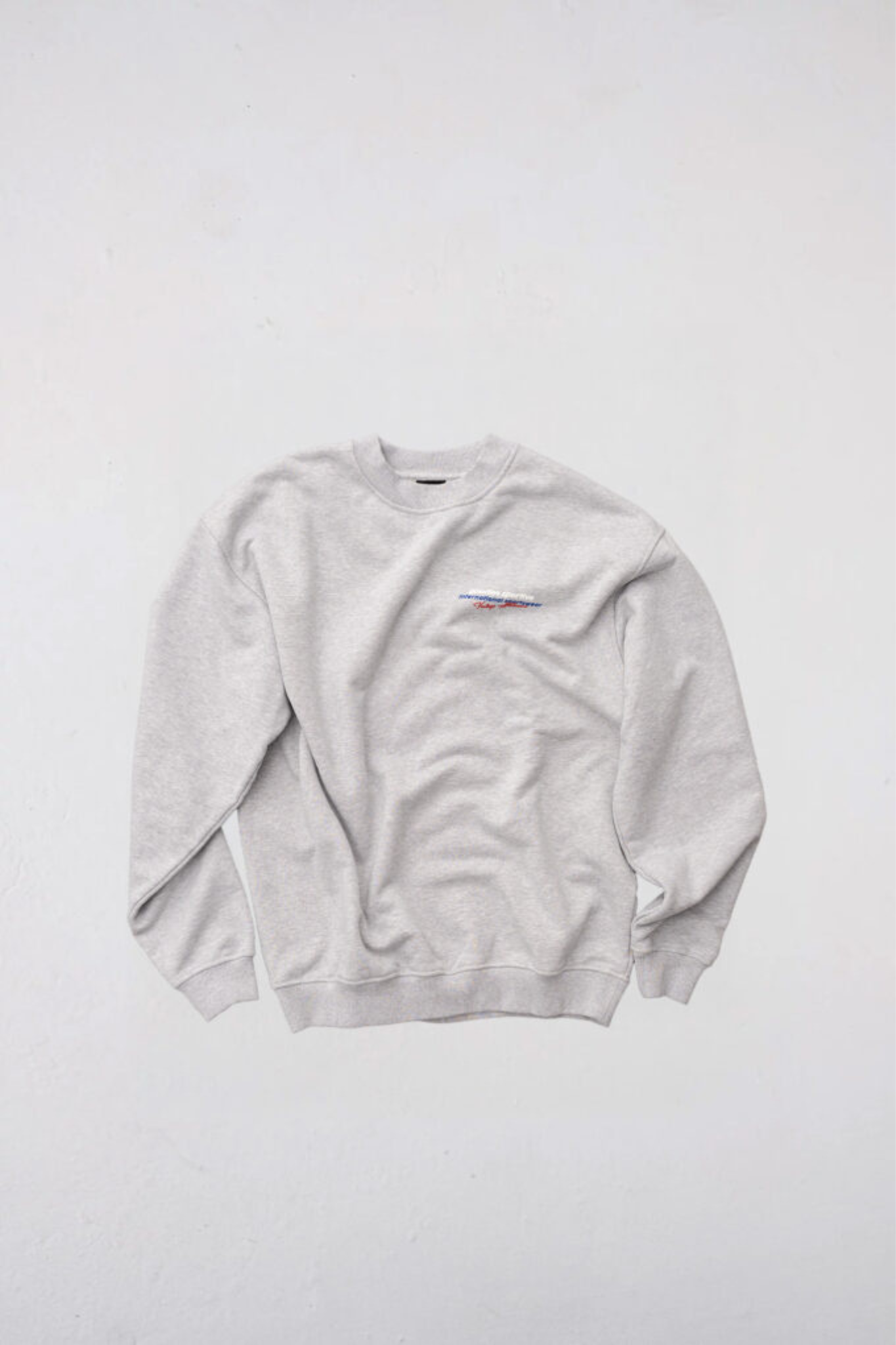 Goodies Sportive imperial premium crewneck in grey and grahpic in red and blue. Front flatlay view