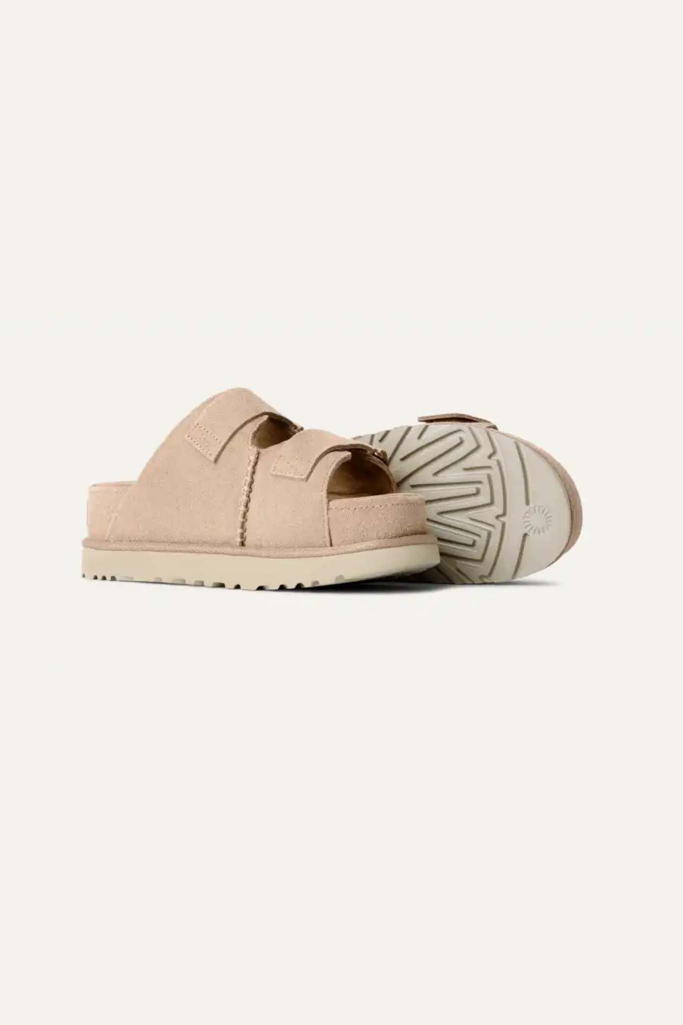 UGG women goldenstar hi slide in sand. Side view