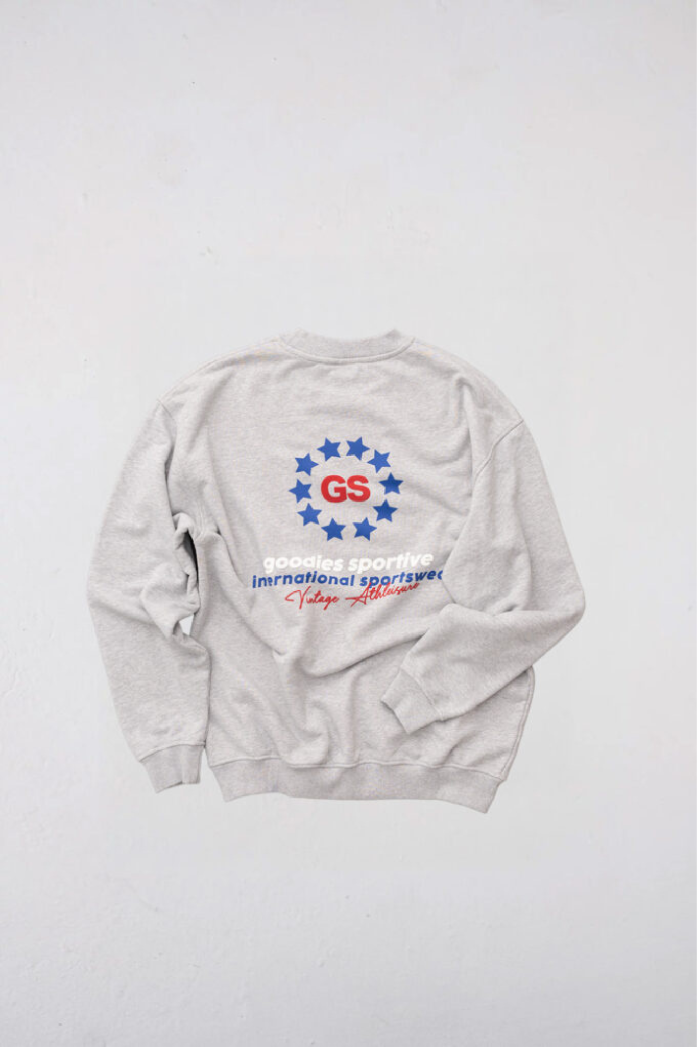 Goodies Sportive imperial premium crewneck in grey and grahpic in red and blue. Back flatlay view