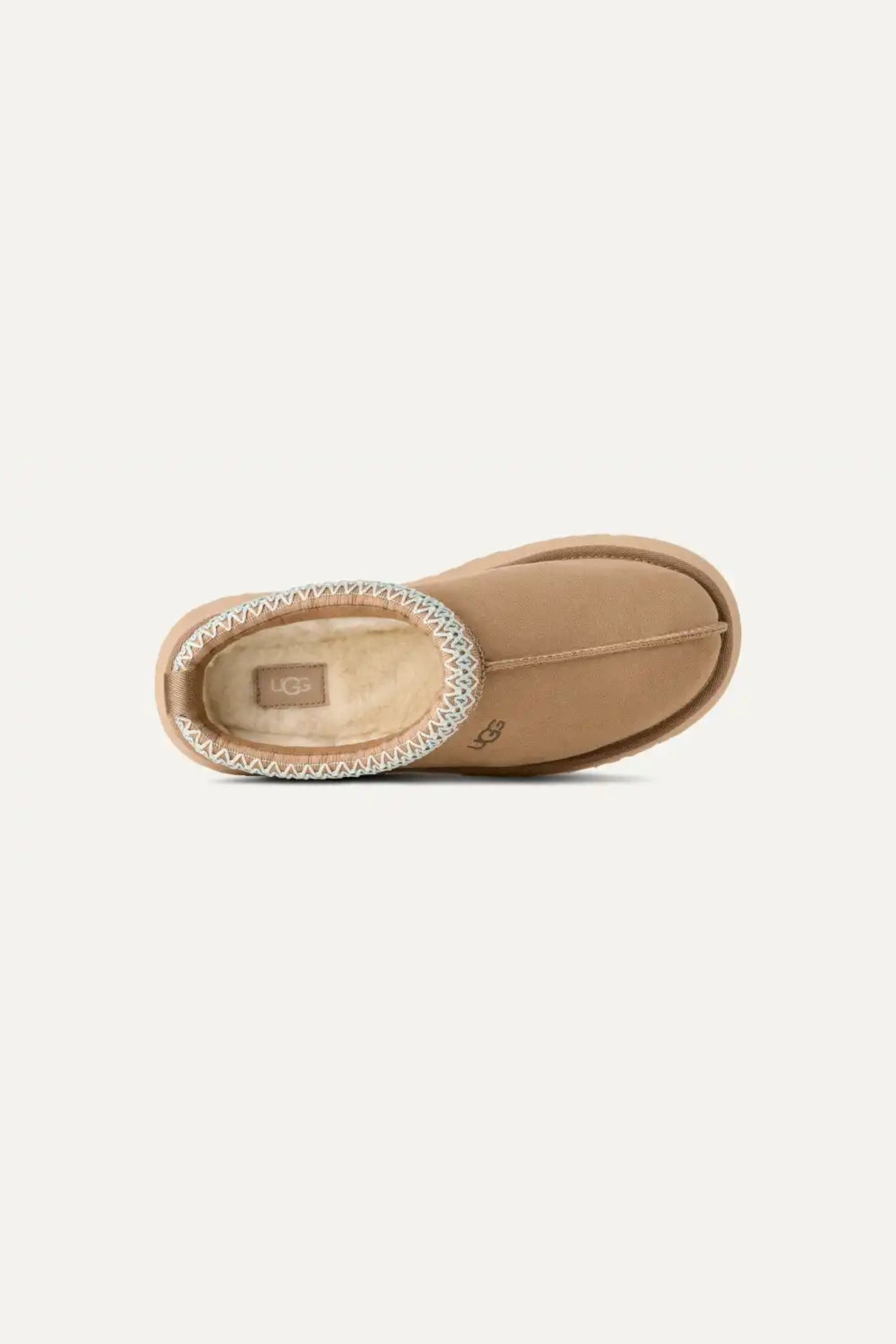 UGG women tazz in sand. Front view