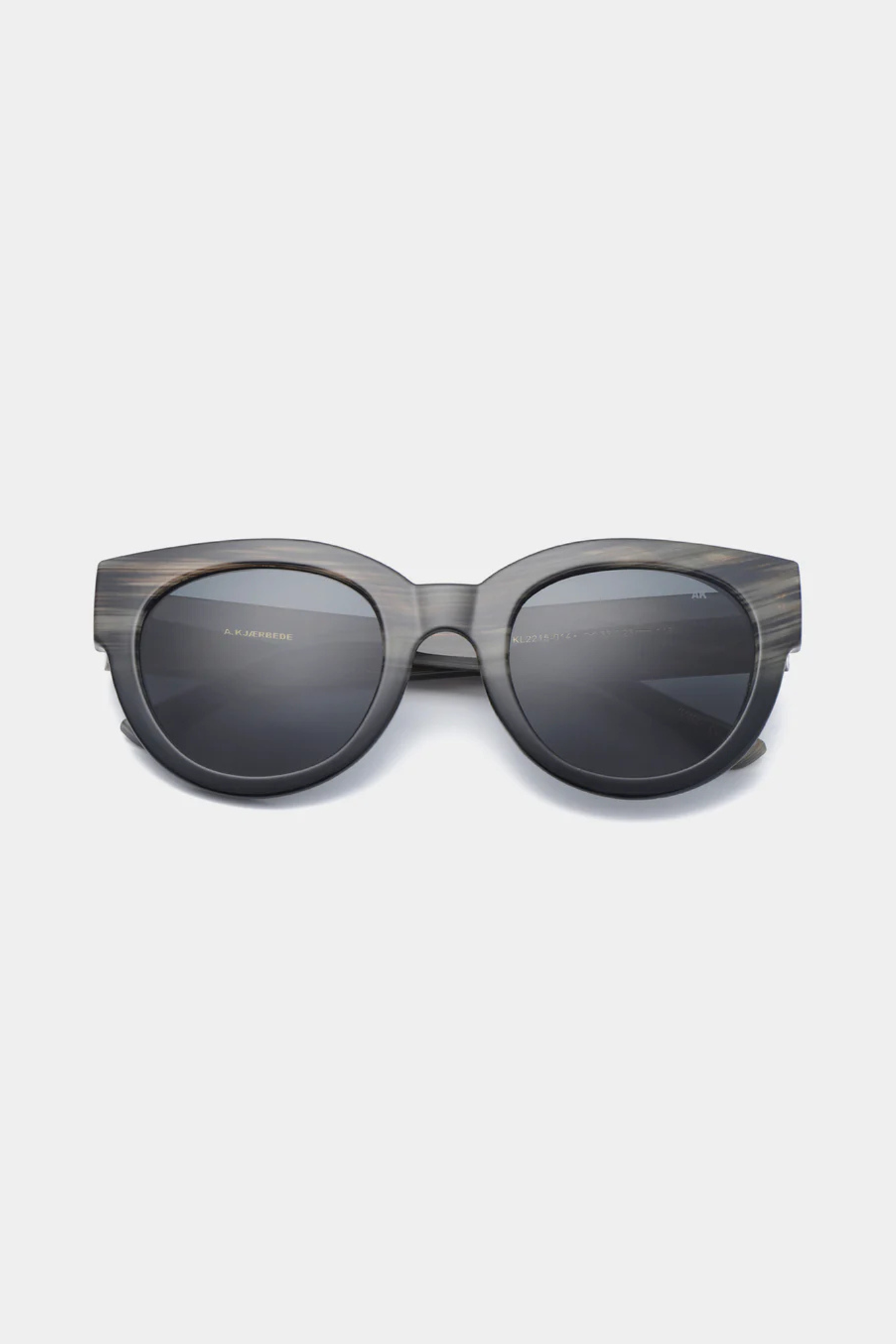 A. Kjaerbede lilly sunglasses in striped horn/black. Front view