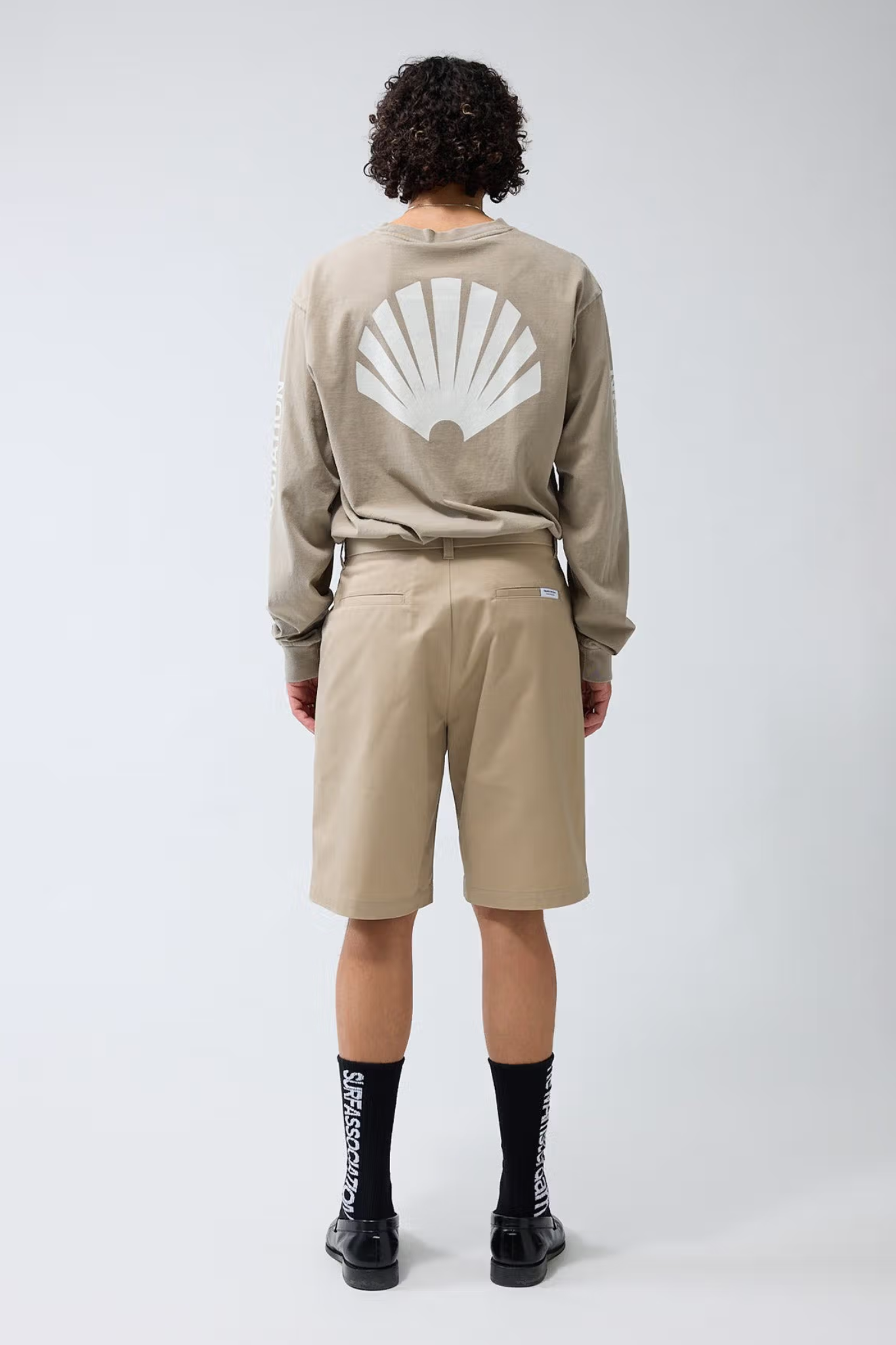 Model wearing the New Amsterdam reworked short in camel. Back view