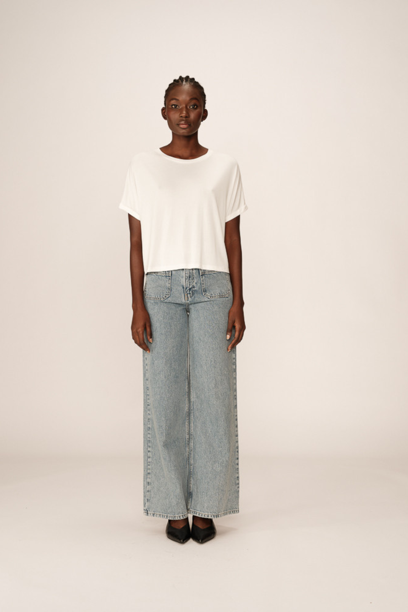 Model wearing the Grace & Mila parma t-shirt in ecru. Front view