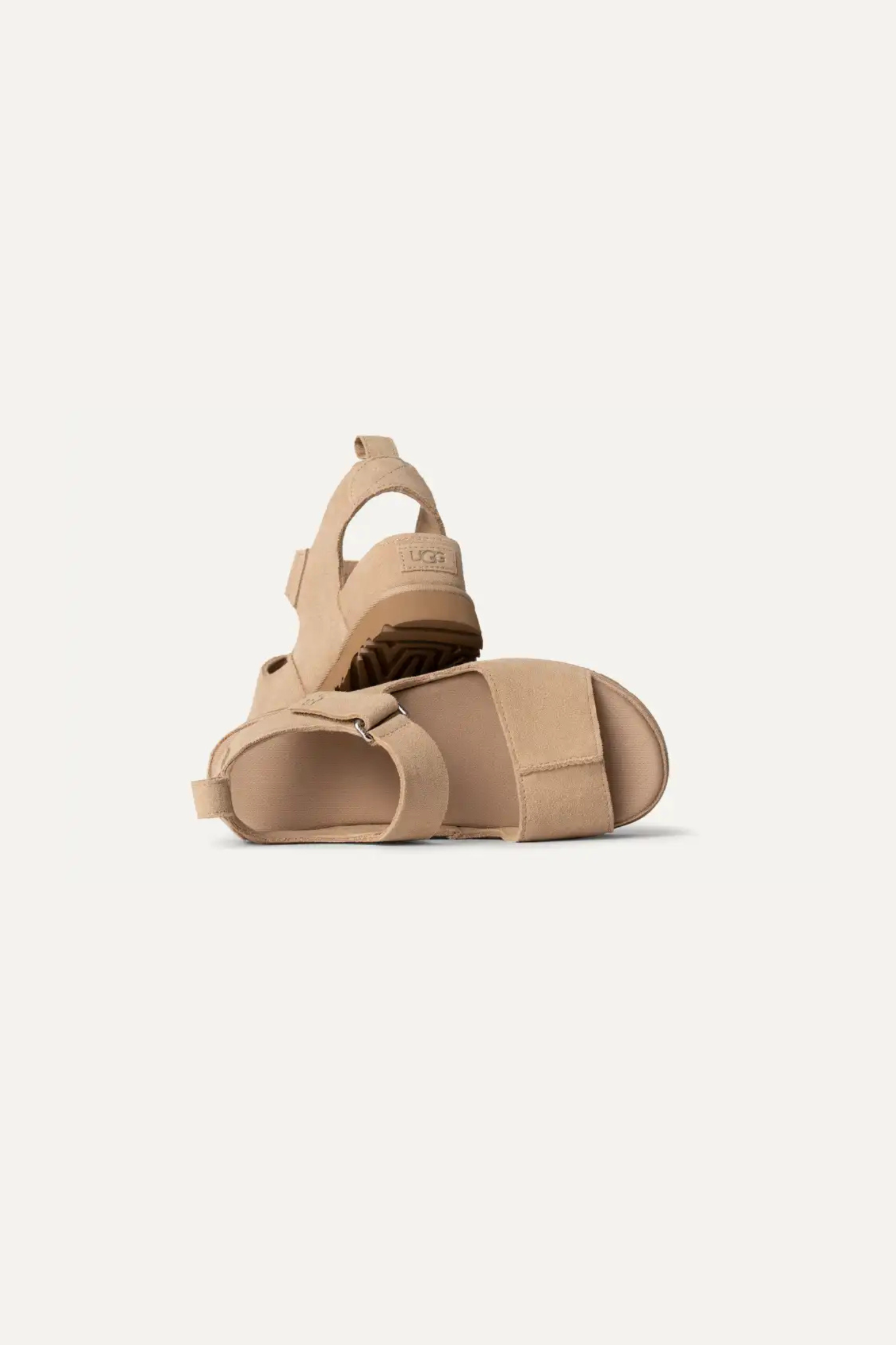 UGG women goldenstar hi in sand. Front view