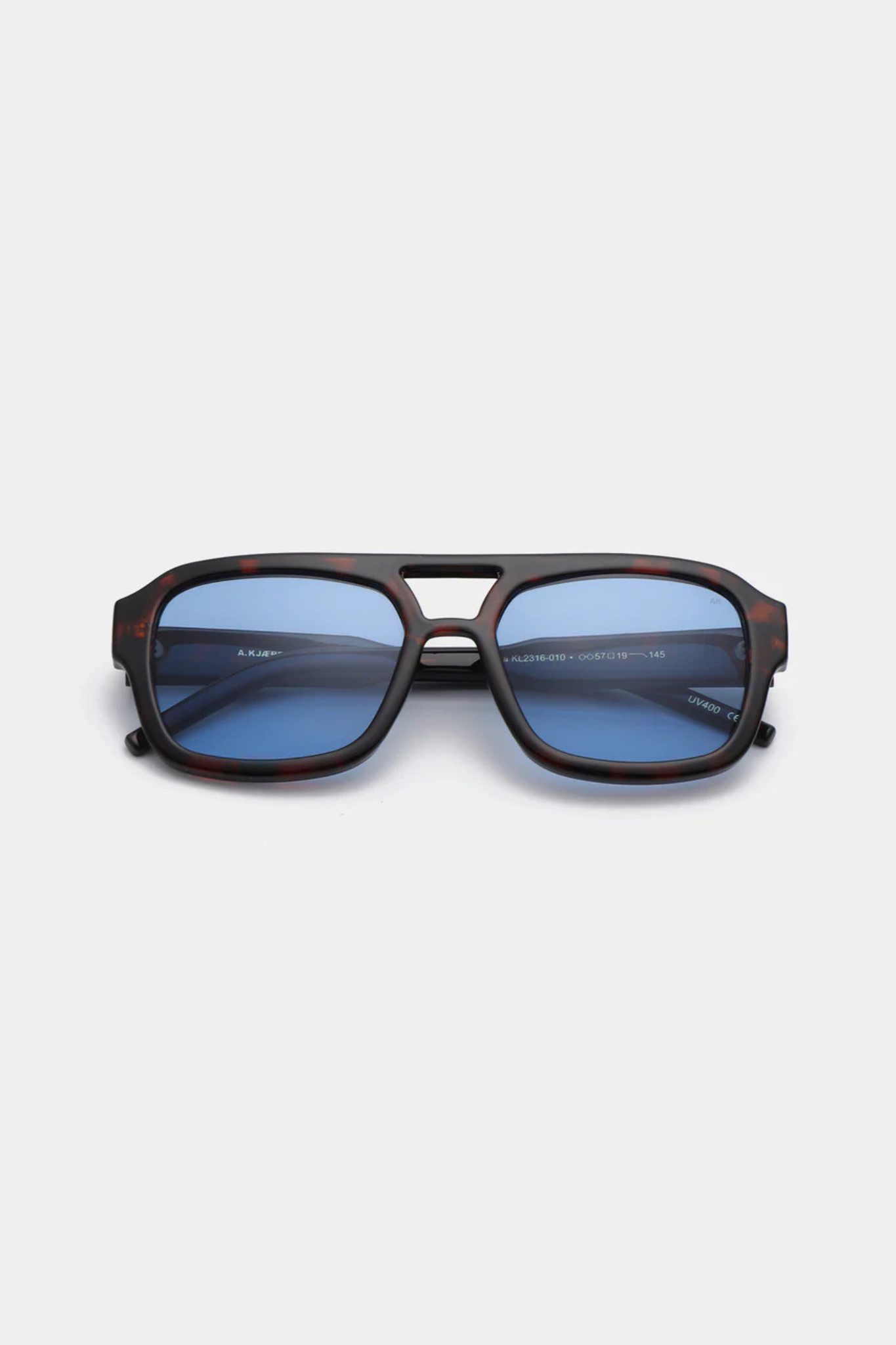 A. Kjaerbede kaya sunglasses in demi tortoise (blue lens). Front view