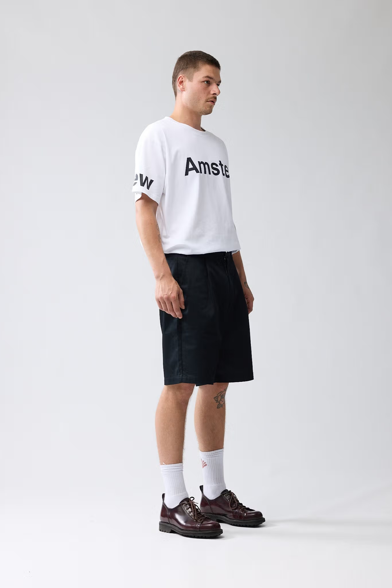 Model wearing the New Amsterdam reworked short in black. Side view