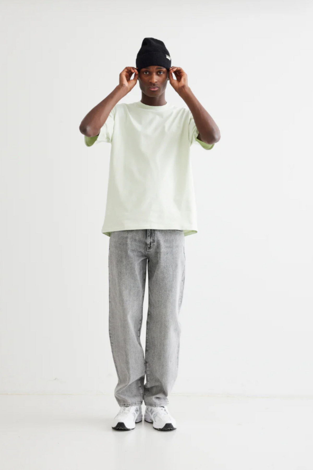 Model wearing the Woodbird Leroy ash grey jeans. Front view