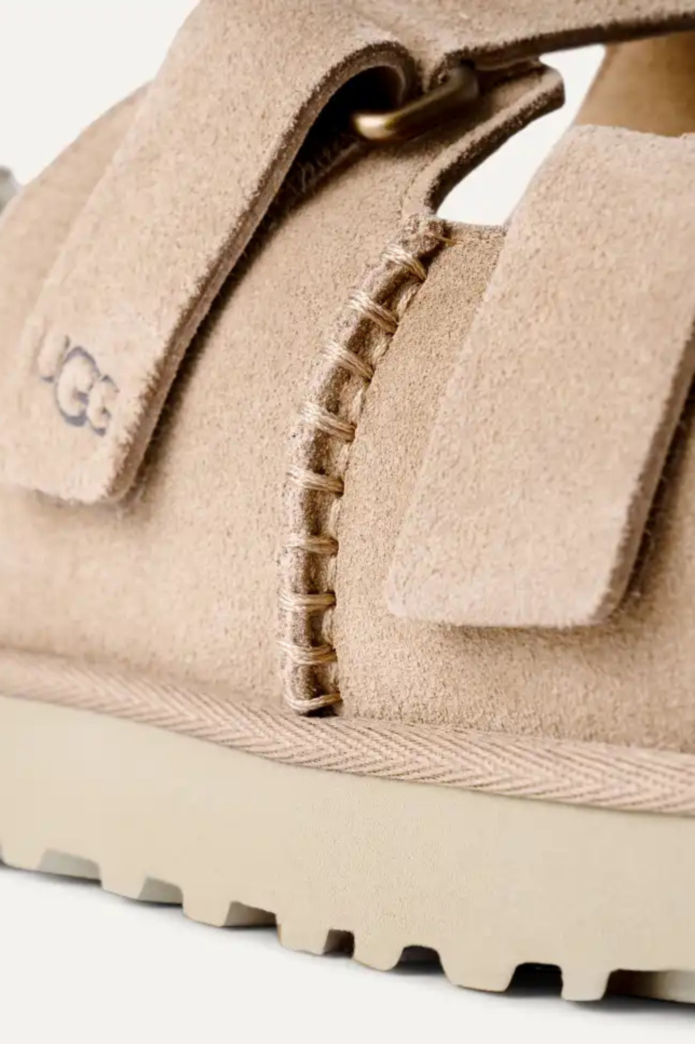 UGG women goldenstar hi slide in sand. Close side view