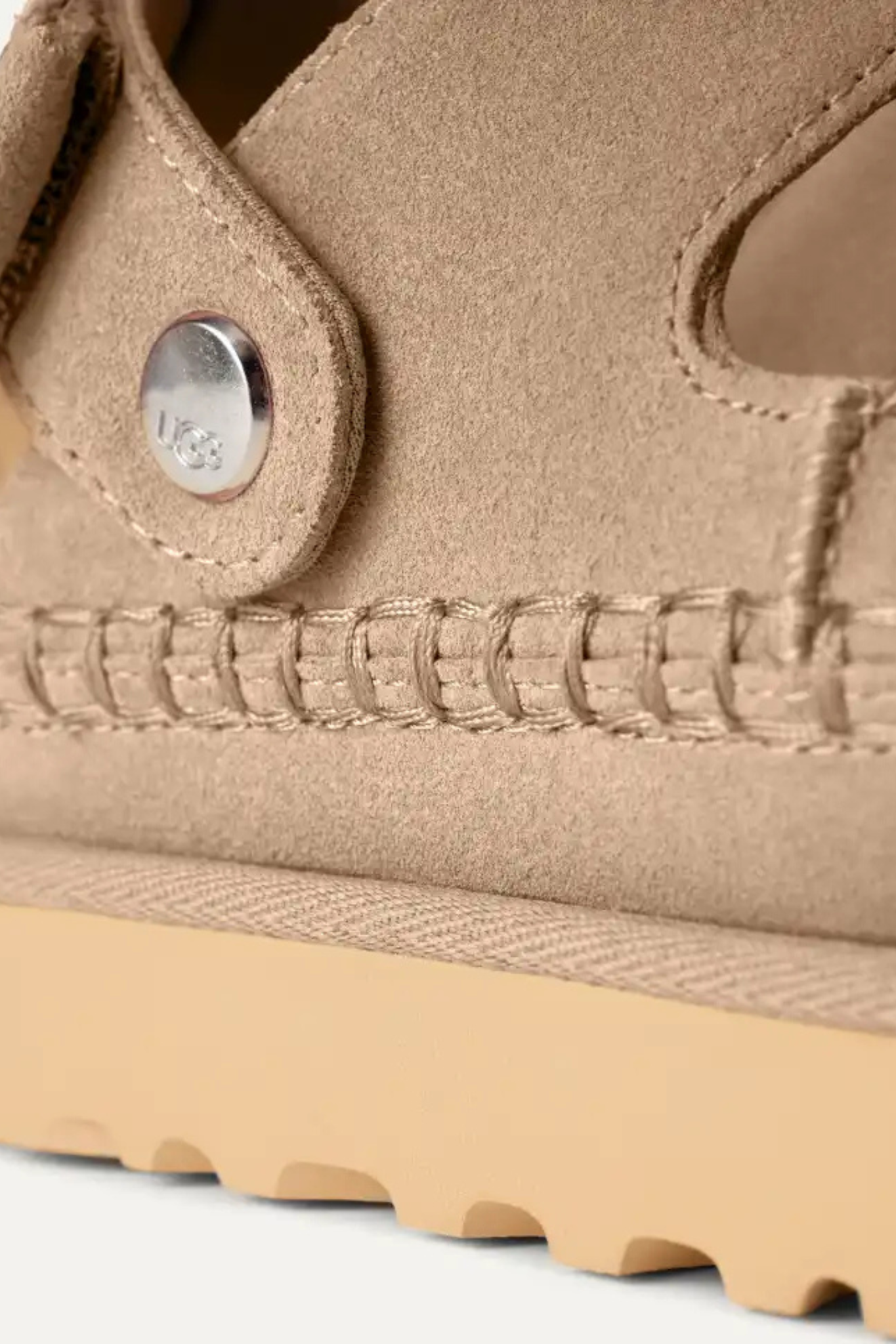 UGG women goldenstar glide in sand. Close side view