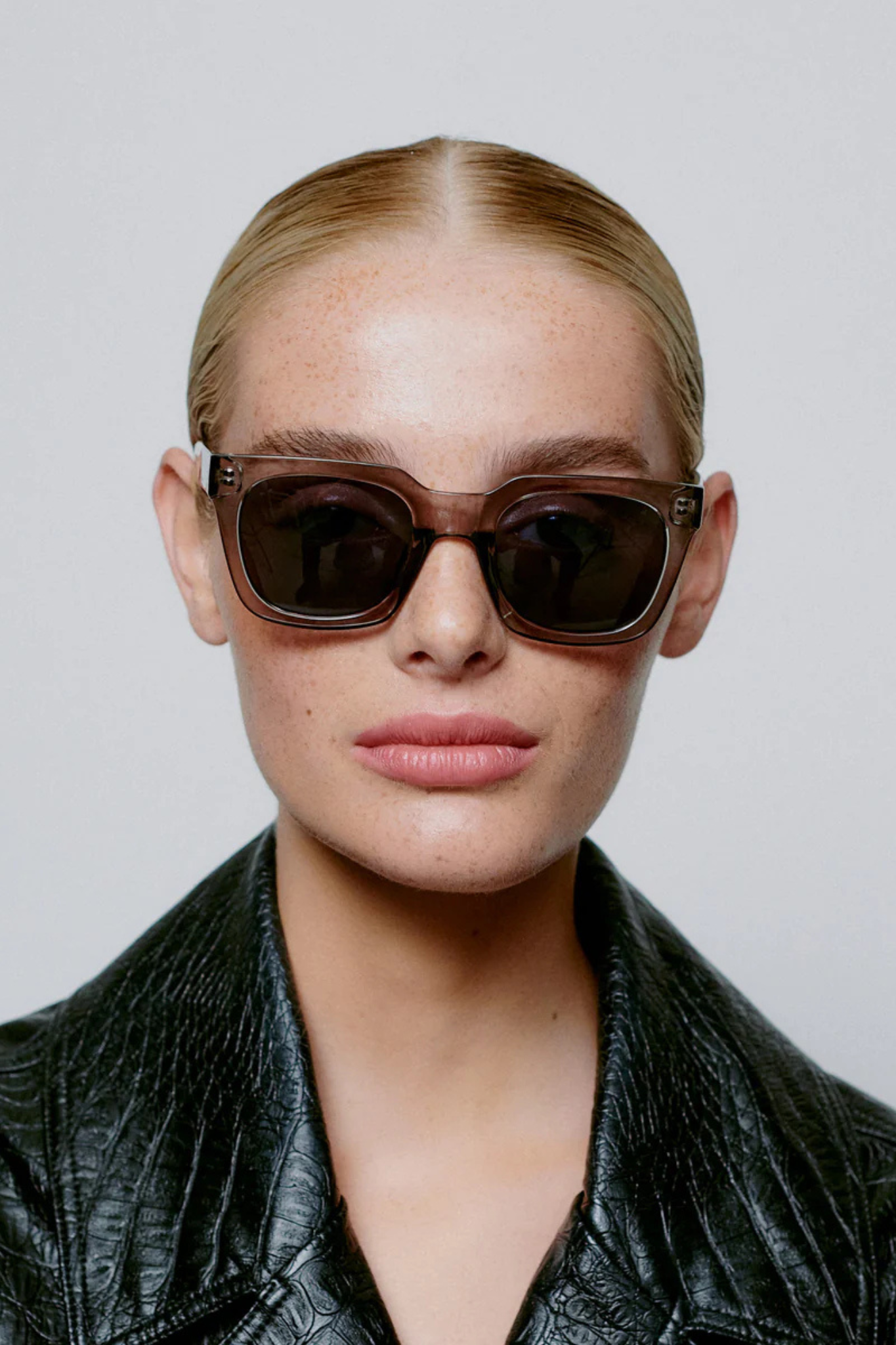 Model wearing the A. Kjaerbede nancy sunglasses in grey transparent. Front view