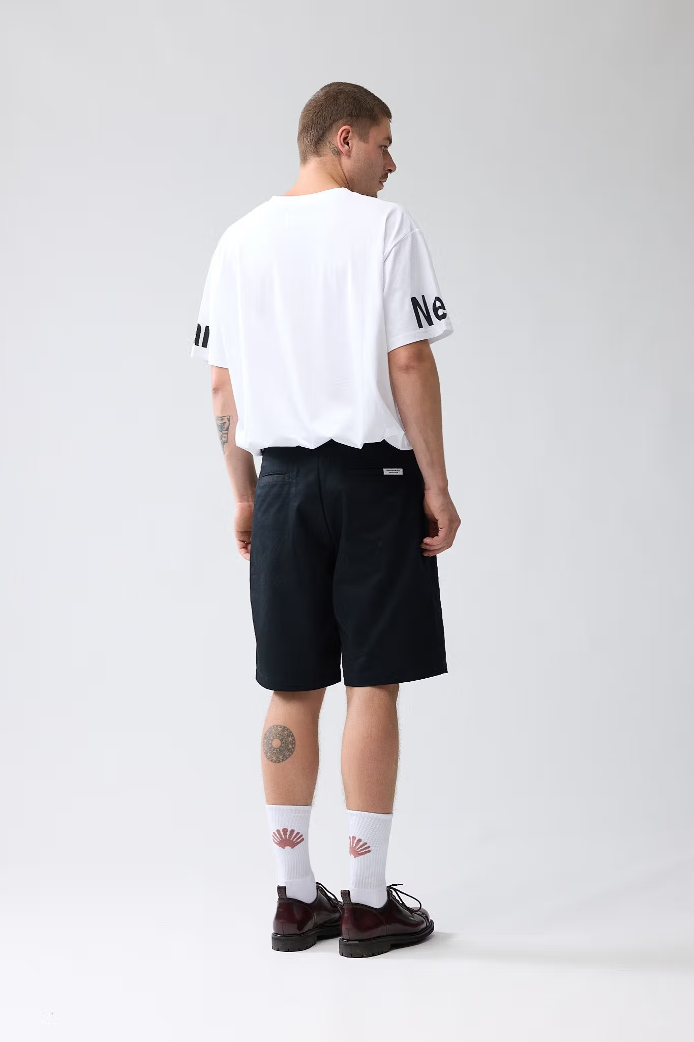 Model wearing the New Amsterdam reworked short in black. Back view