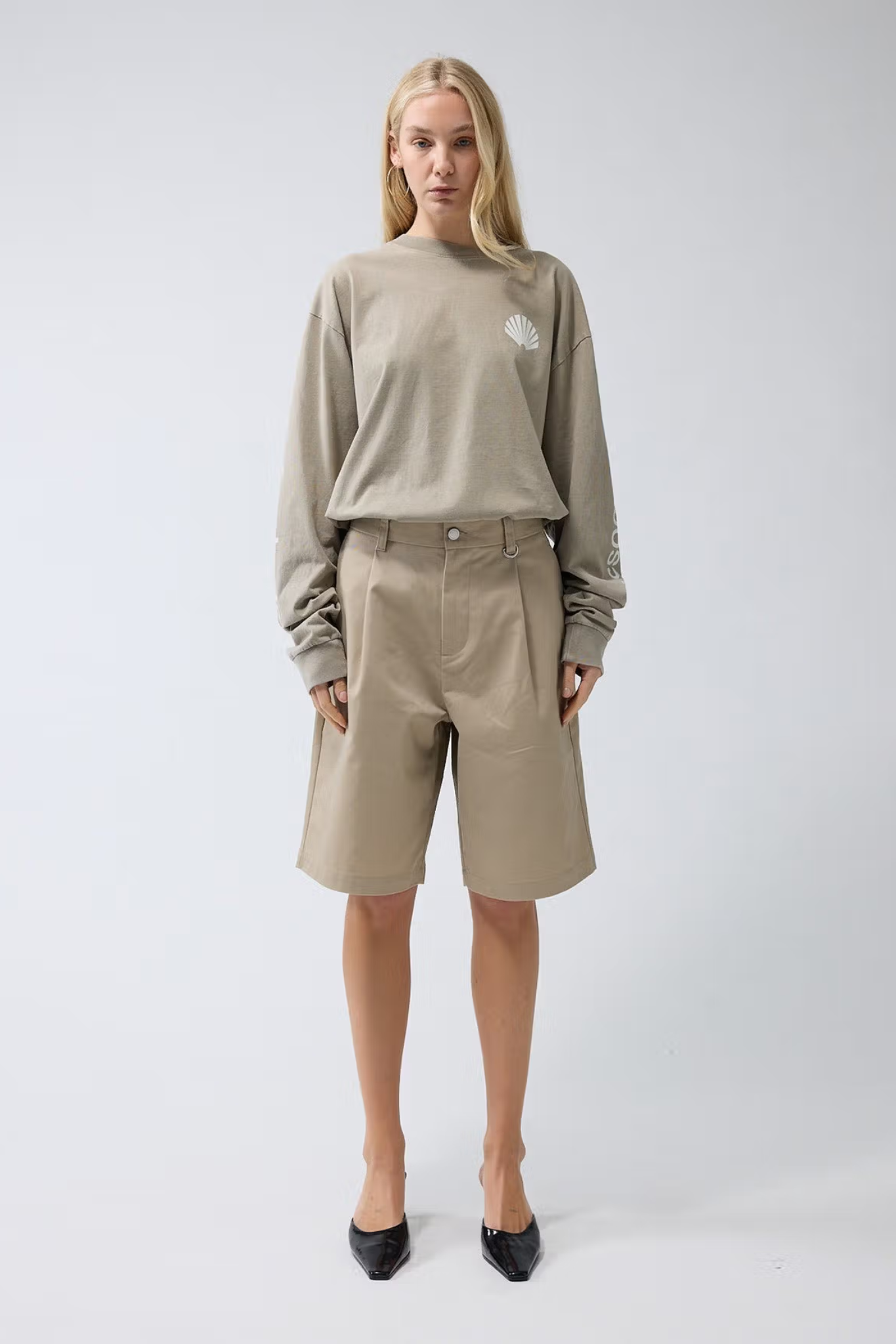 Model wearing the New Amsterdam reworked short in camel. Front view