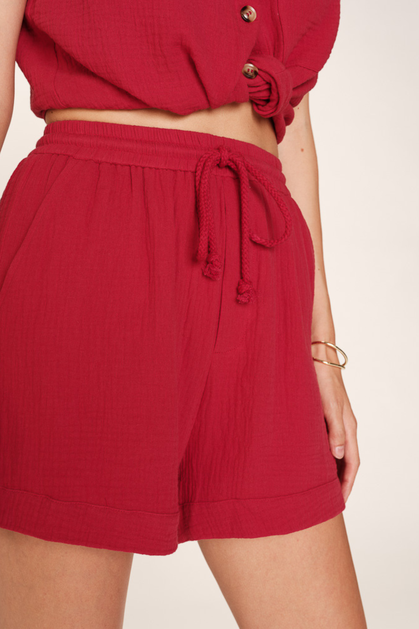 Model wearing the Grace & Mila rio short in red cerise. Front view