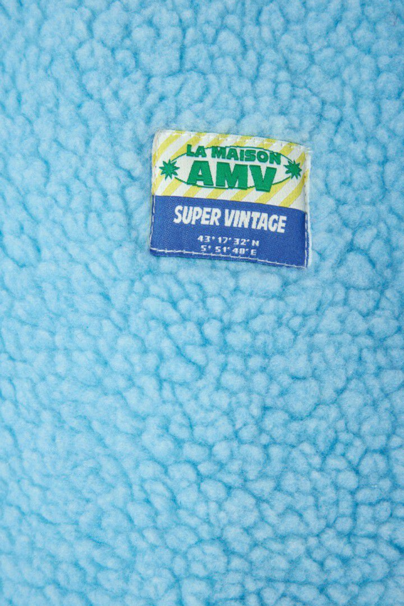 American Vintage hoktown jacket in sky blue. Close logo view