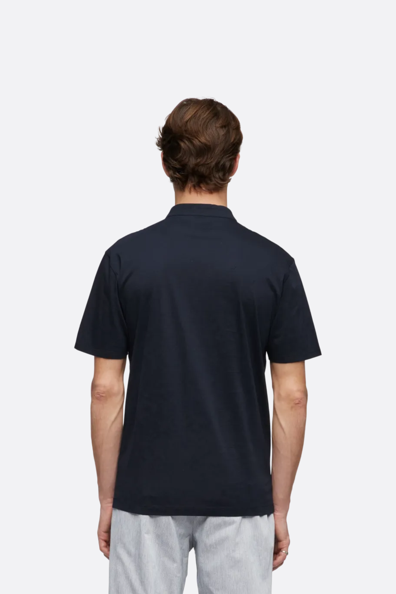 Model wearing the Drykorn louis t-shirt in blue. Back view