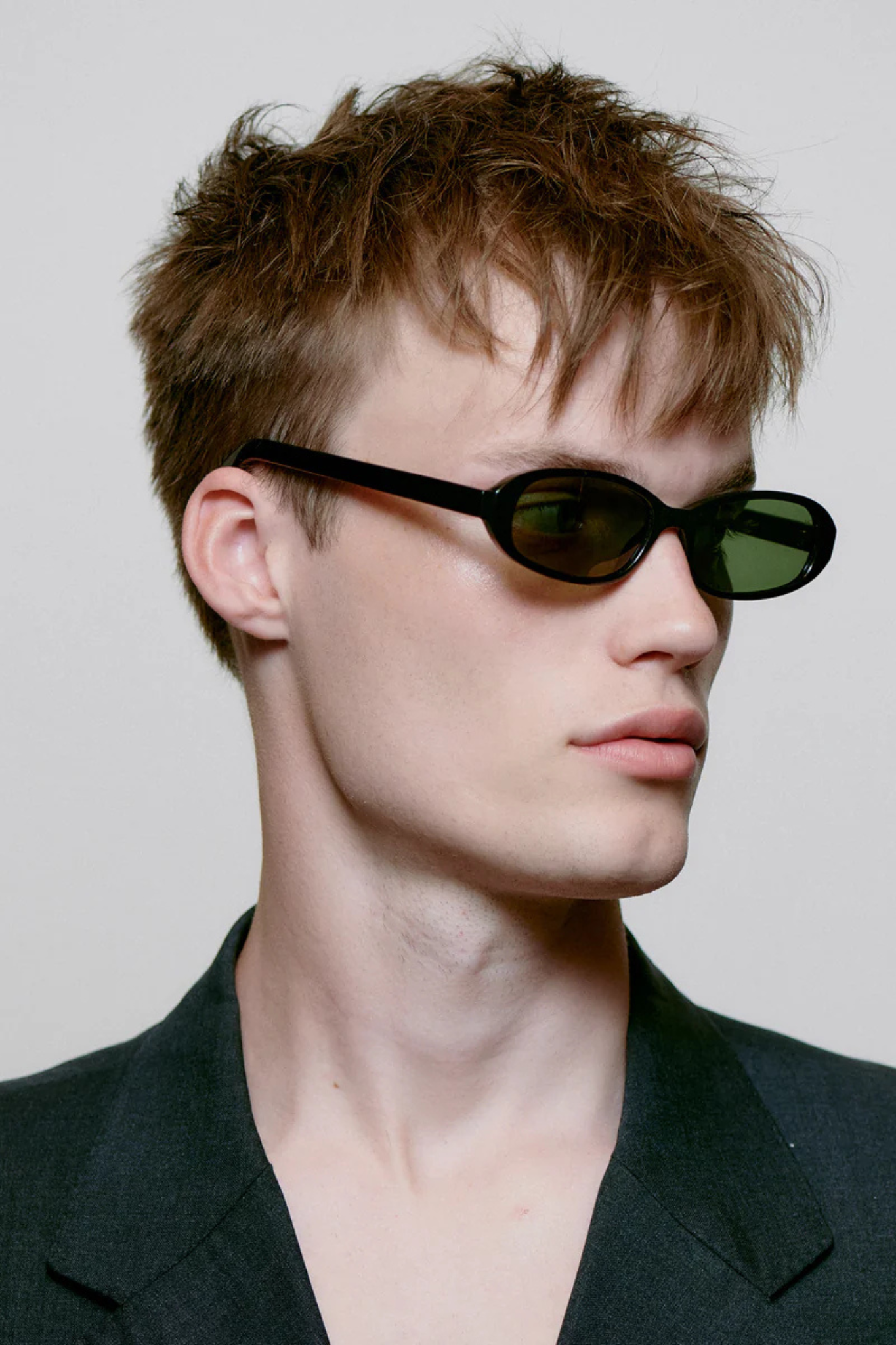Model wearing the A. Kjaerbede macy sunglasses in black. Side view
