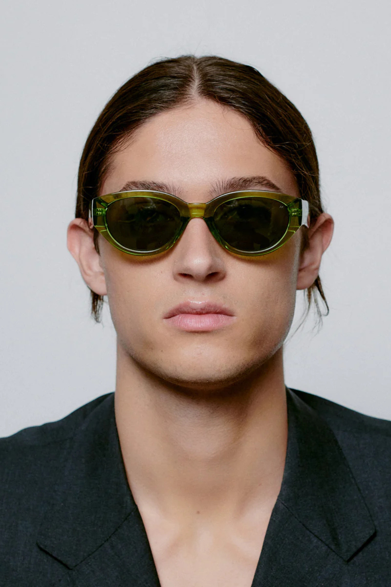 Model wearing the A. Kjaerbede winnie sunglasses in light olive transparent. Front view