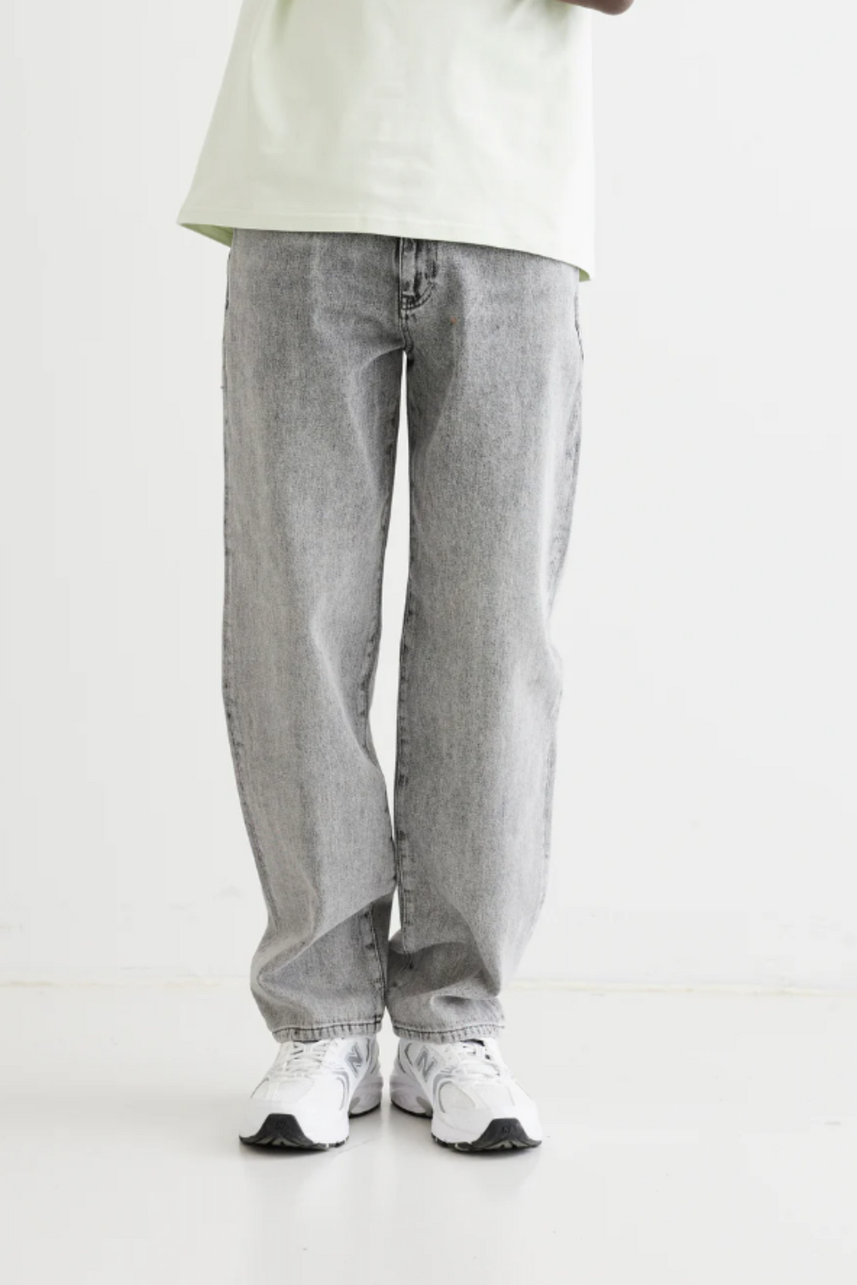 Model wearing the Woodbird Leroy ash grey jeans. Front view