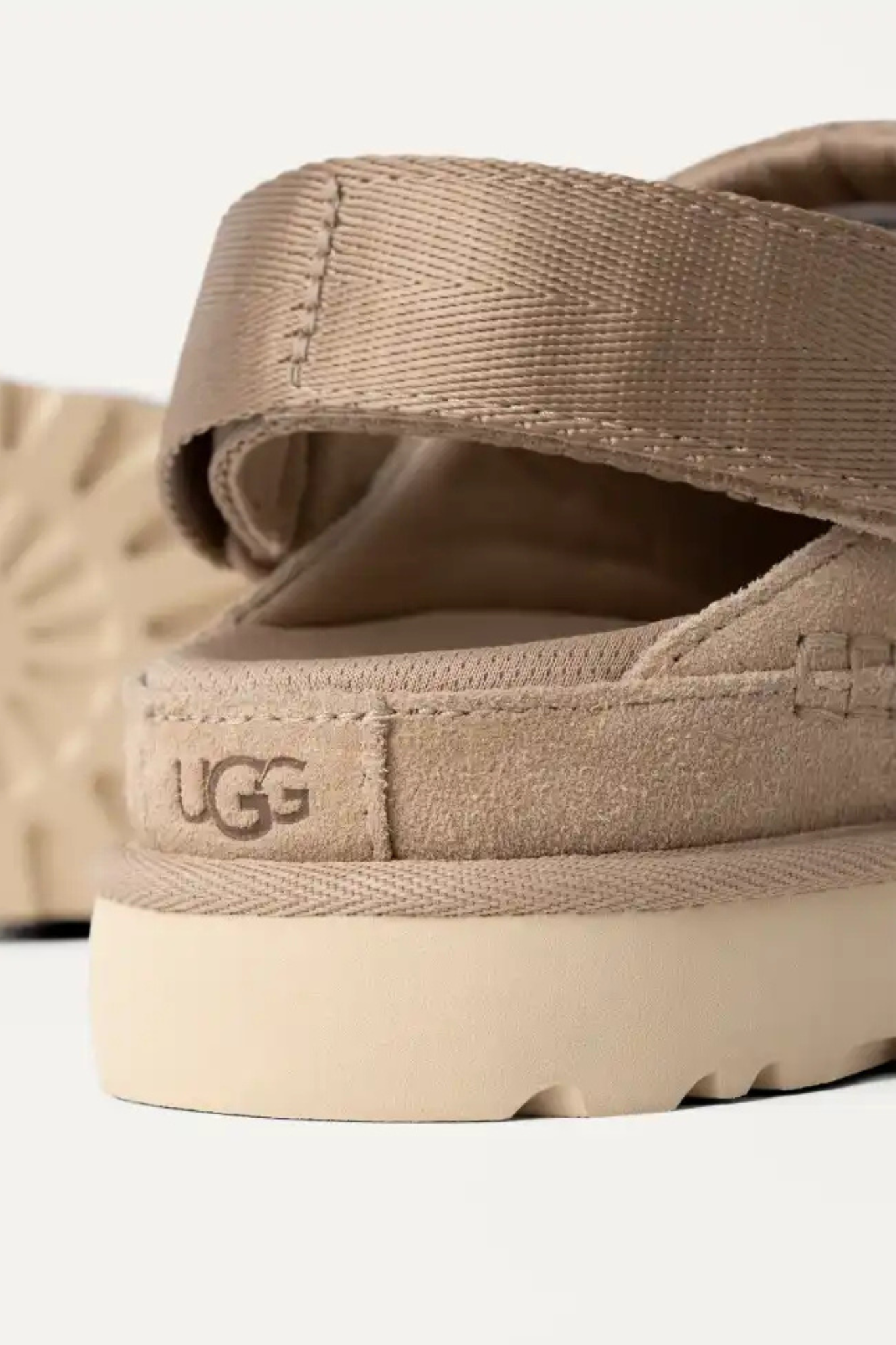 UGG women goldenstar clog in sand. Back view
